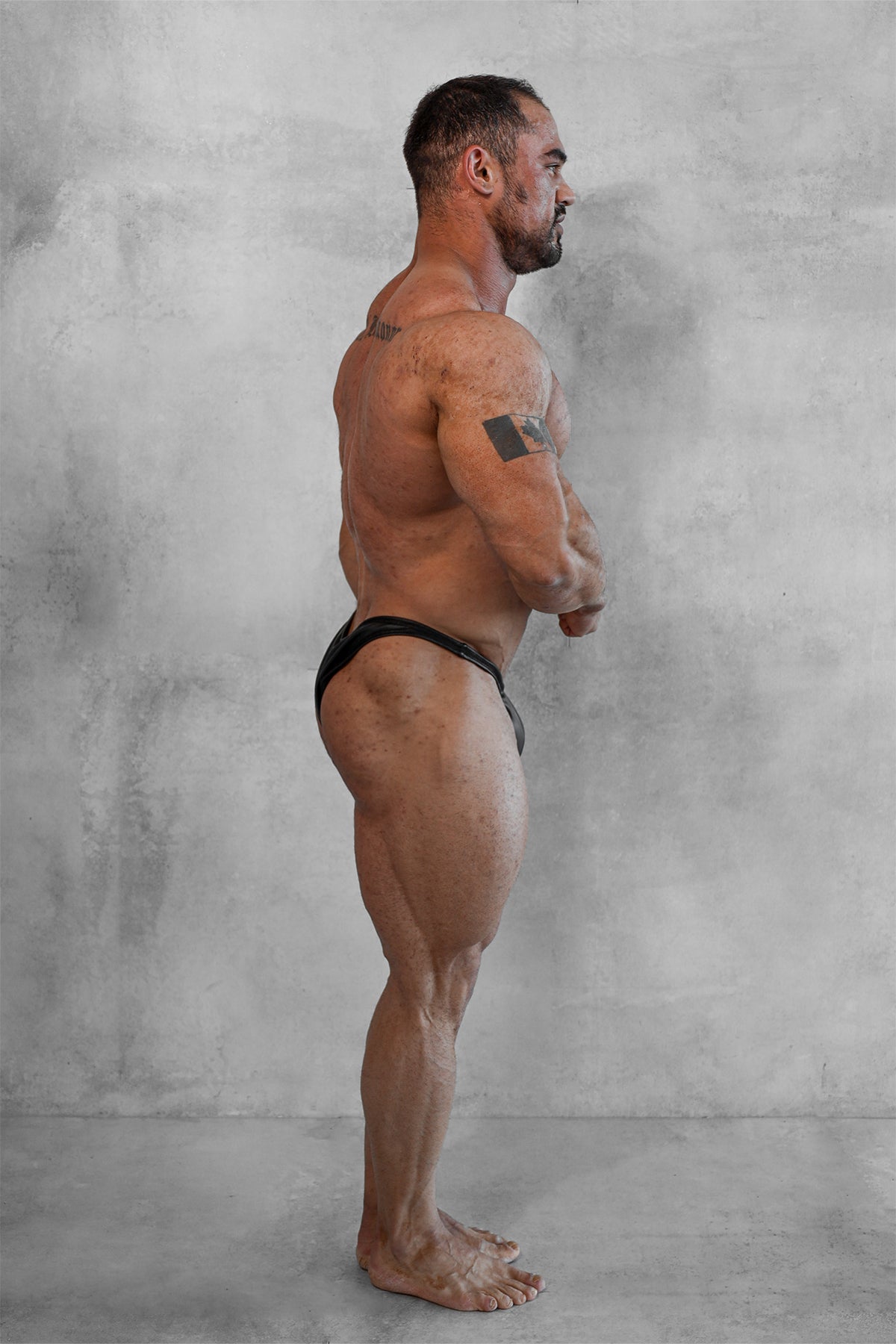 Men’s bodybuilding posing trunks in matte black with sleek, form-fitting design ideal for competitions and training