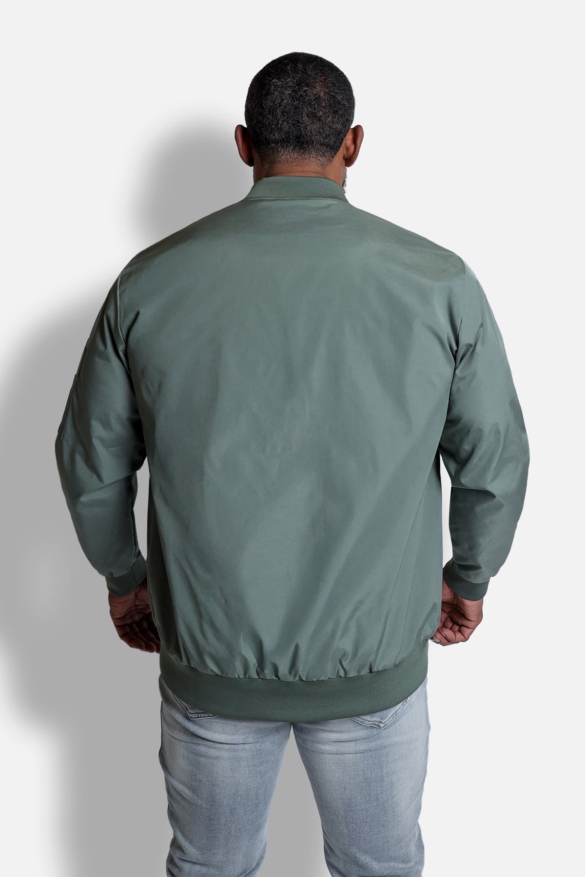 Men’s premium olive bomber jacket made of smooth slightly shiny fabric with ribbed cuffs and hem