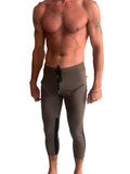 Mens 4/5 zipper pocket capri yoga pants in army green with black side panels and drawstring waistband for comfort