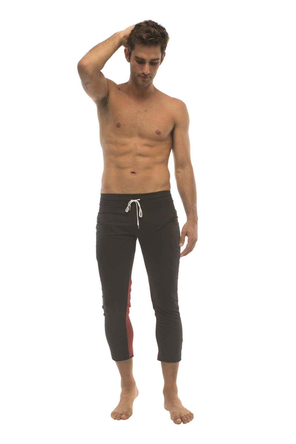 Mens 4/5 zipper pocket capri yoga pants in black with charcoal and red featuring black capri swim trunks with white drawstring and red side panels