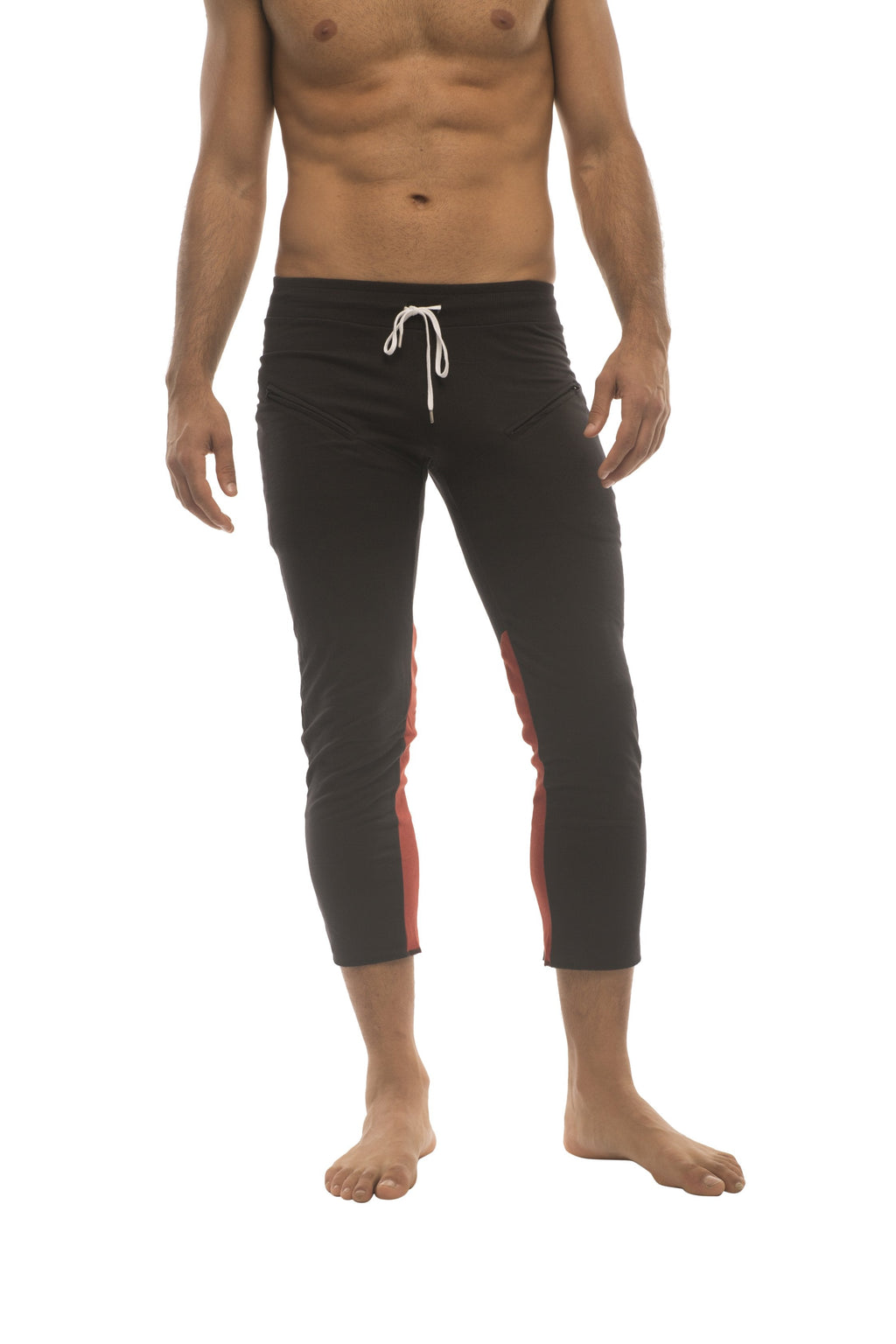 Mens black capri swim trunks with red side panels and white drawstring waistband for active wear
