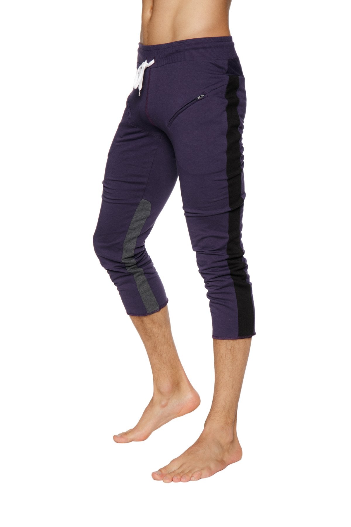 Mens 4/5 zipper pocket capri yoga pants in eggplant with black side panels and a white drawstring waistband