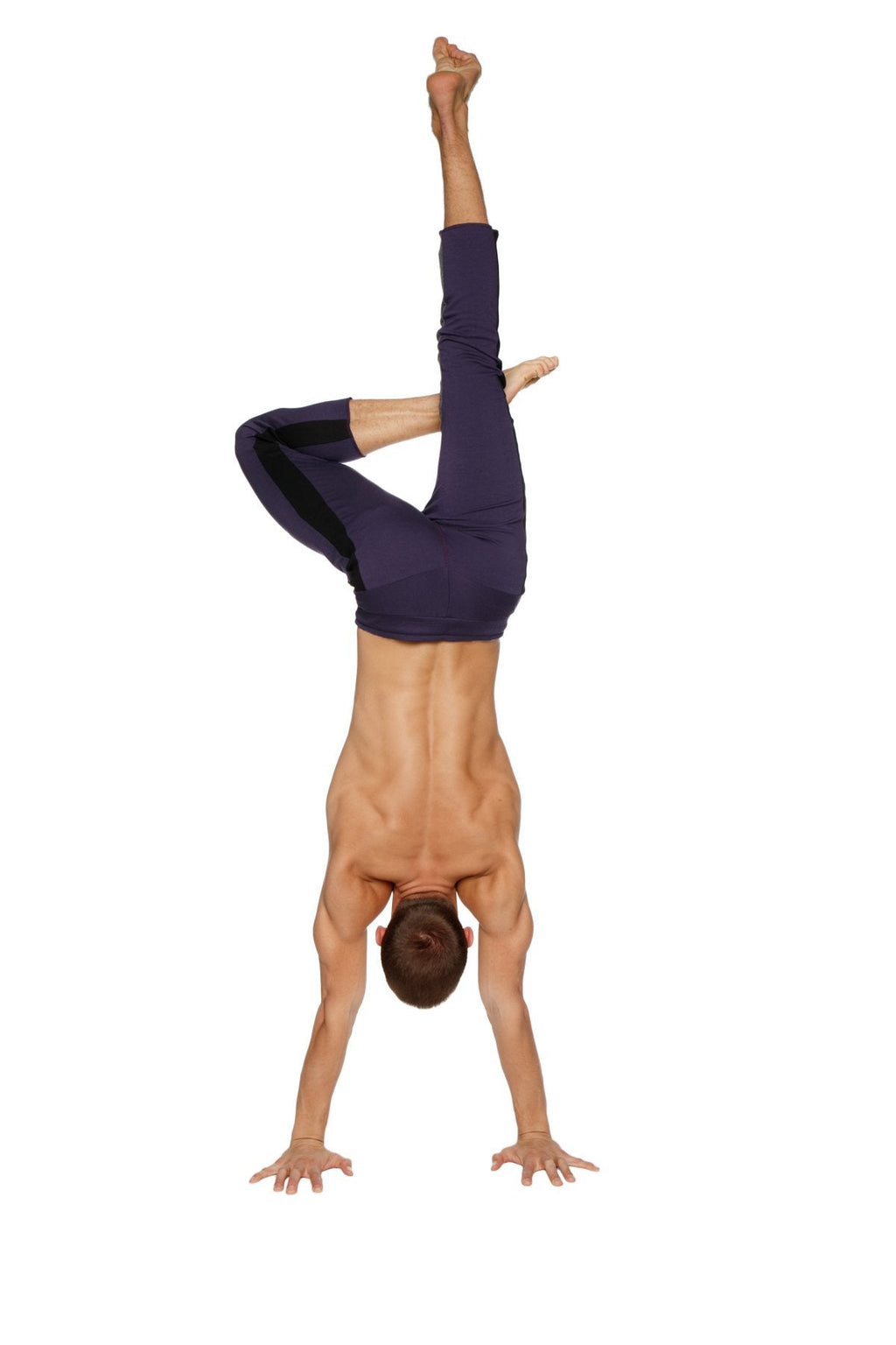 A man performing a handstand wearing mens 4/5 zipper pocket capri yoga pants in eggplant with black and charcoal