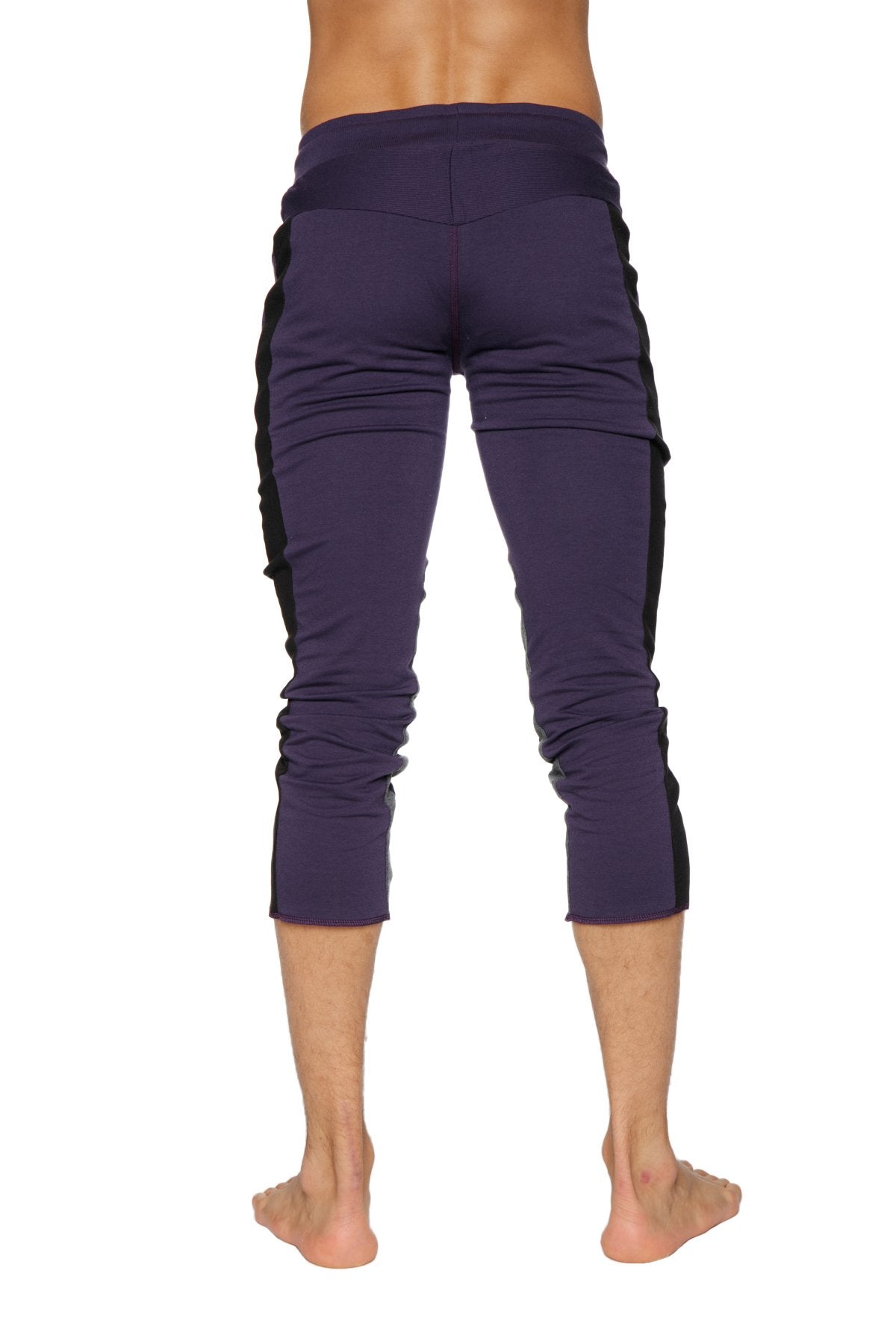 Mens capri yoga pants in eggplant with black side panels featuring 4 5 zipper pockets for active wear