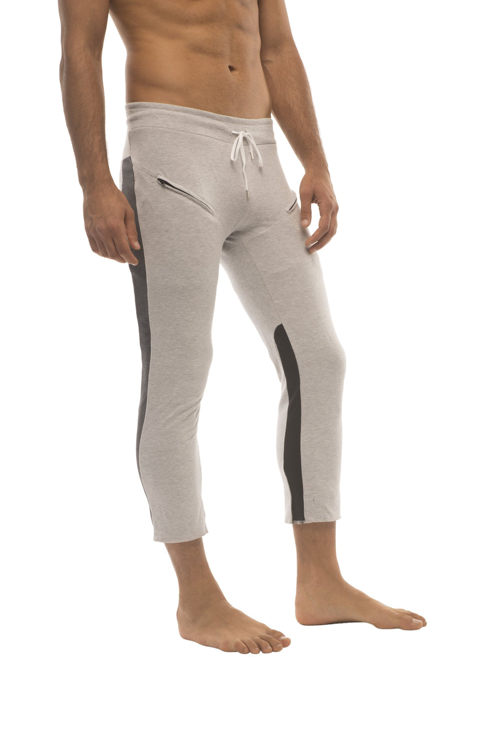 Mens light gray 4/5 zipper pocket capri yoga pants with black side stripes and white drawstring waistband
