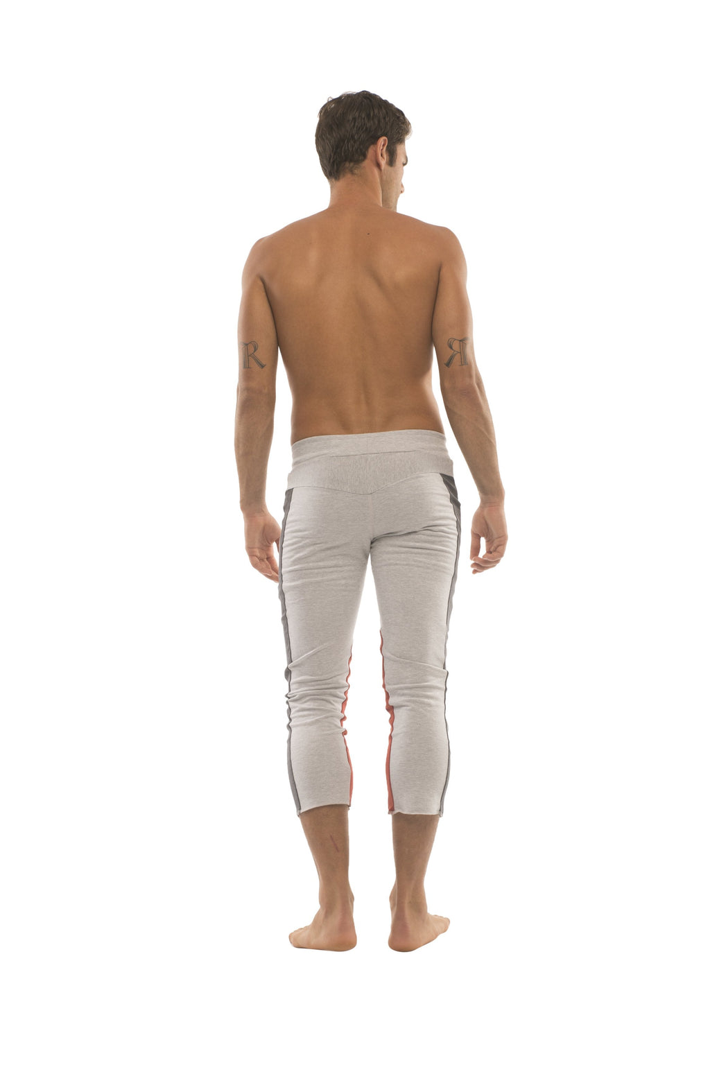 White athletic capri yoga pants with black and red side stripes and zipper pockets for men