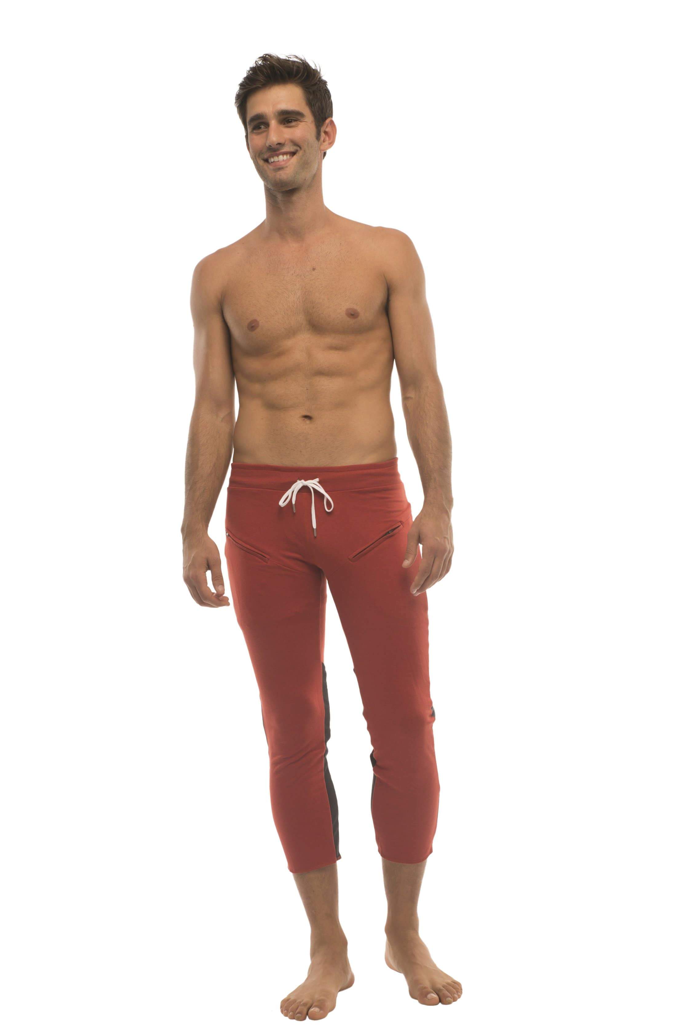Mens 4/5 zipper pocket capri yoga pants in red with white drawstring waistband and black side panels
