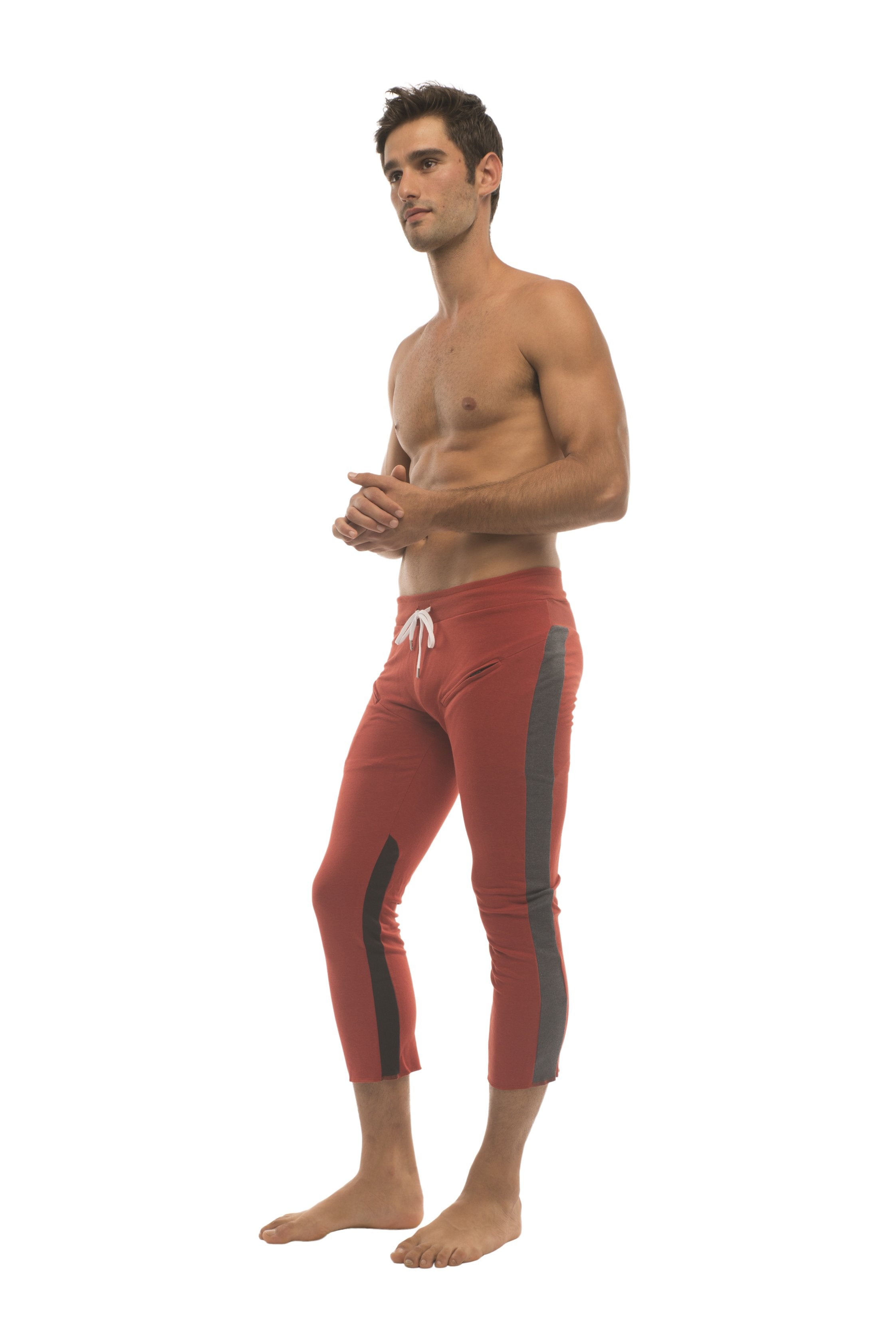 Mens 4/5 zipper pocket capri yoga pants in red with charcoal side stripes and white drawstring waistband