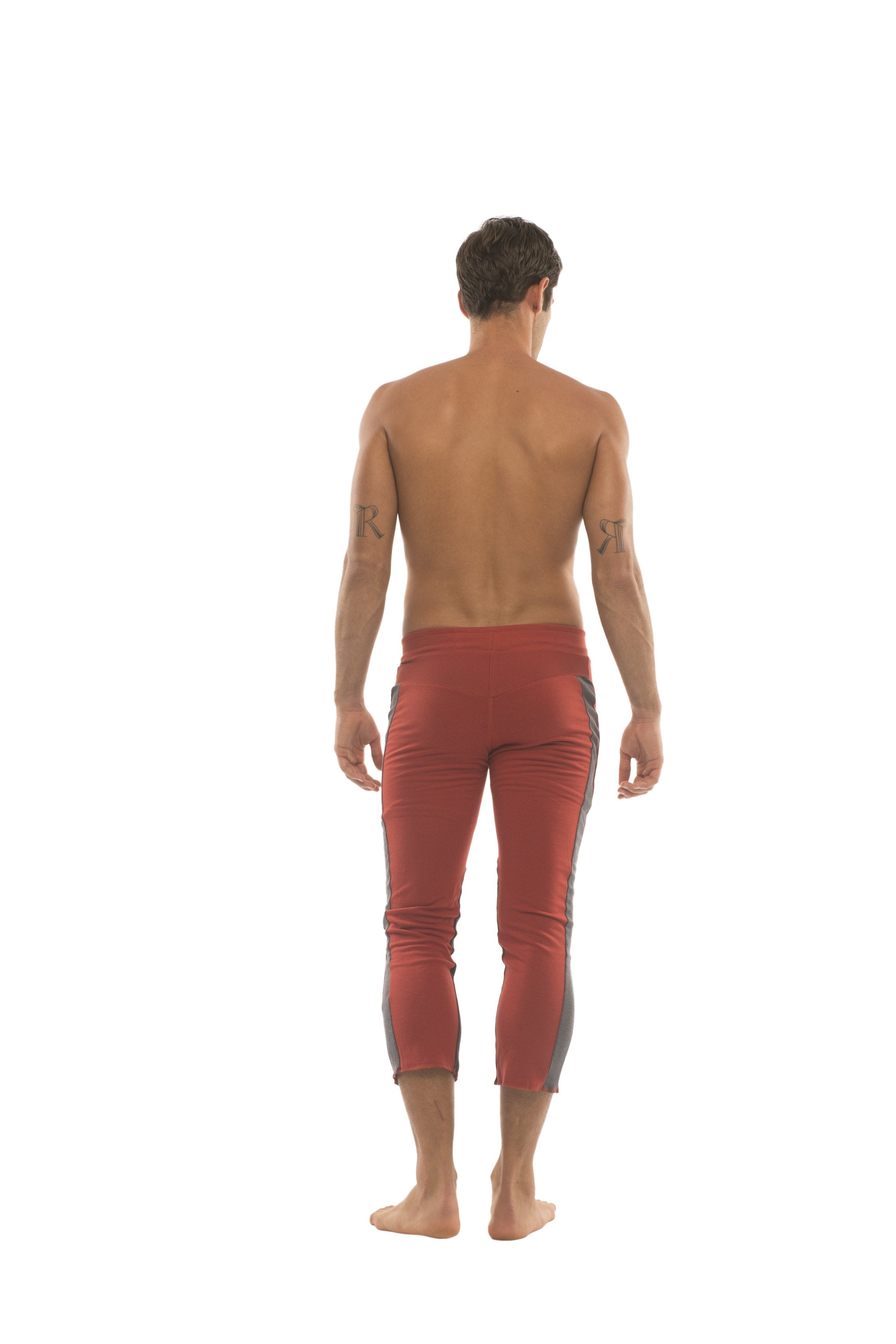 Mens red capri yoga pants with gray side panels and 4 5 zipper pockets for comfortable active wear
