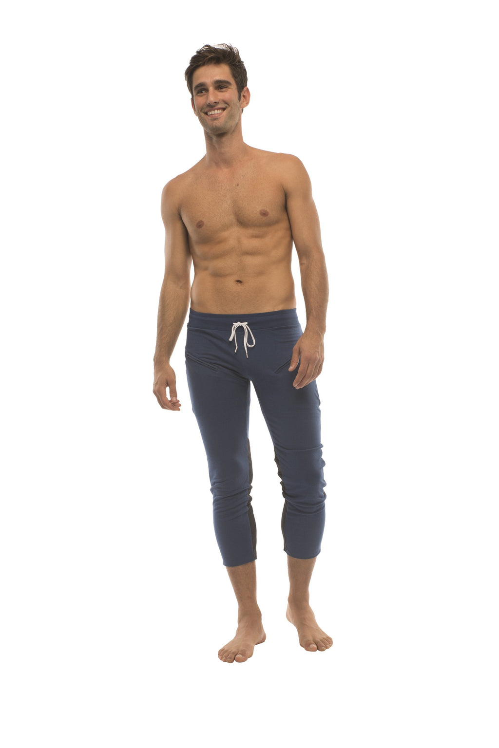 Mens navy blue capri-length yoga pants with white drawstring waistband and zipper pockets for activewear use