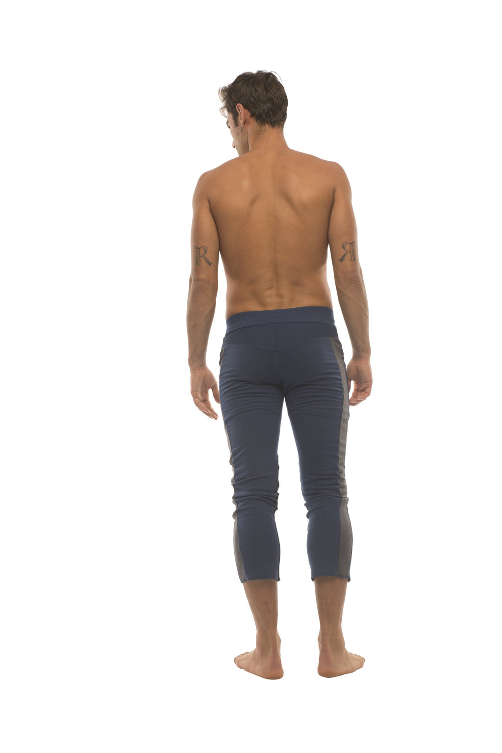 Mens navy blue capri yoga pants with subtle side stripes and 4 5 zipper pockets in royal with charcoal and black