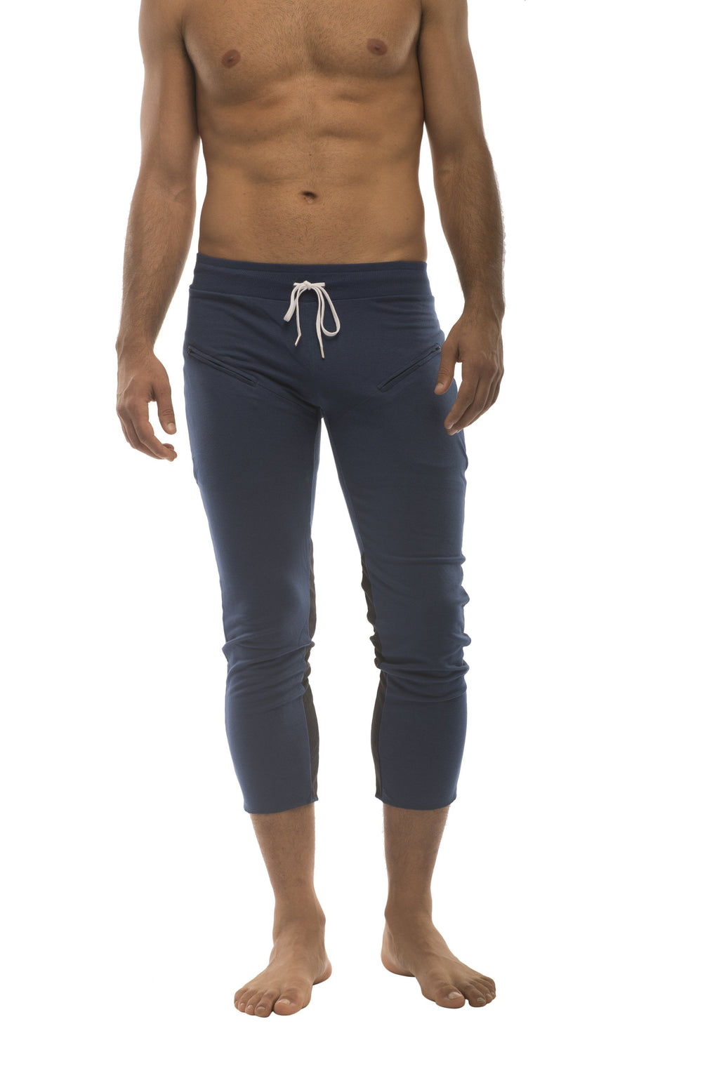 Men’s navy blue capri yoga pants with white drawstring waistband and zipper pockets for athletic use