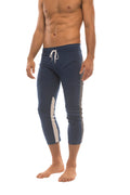 Navy blue mens 4/5 zipper pocket capri yoga pants with white side stripes and matching drawstring waistband
