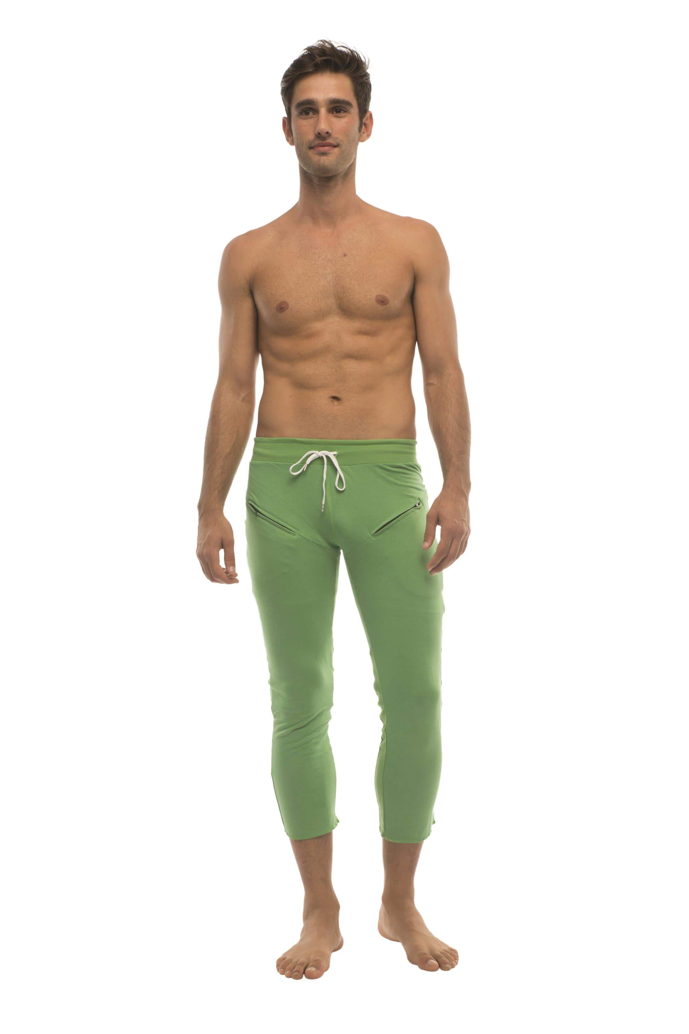 Mens 4/5 zipper pocket capri yoga pants in solid bamboo green with white drawstring waistband and side pockets