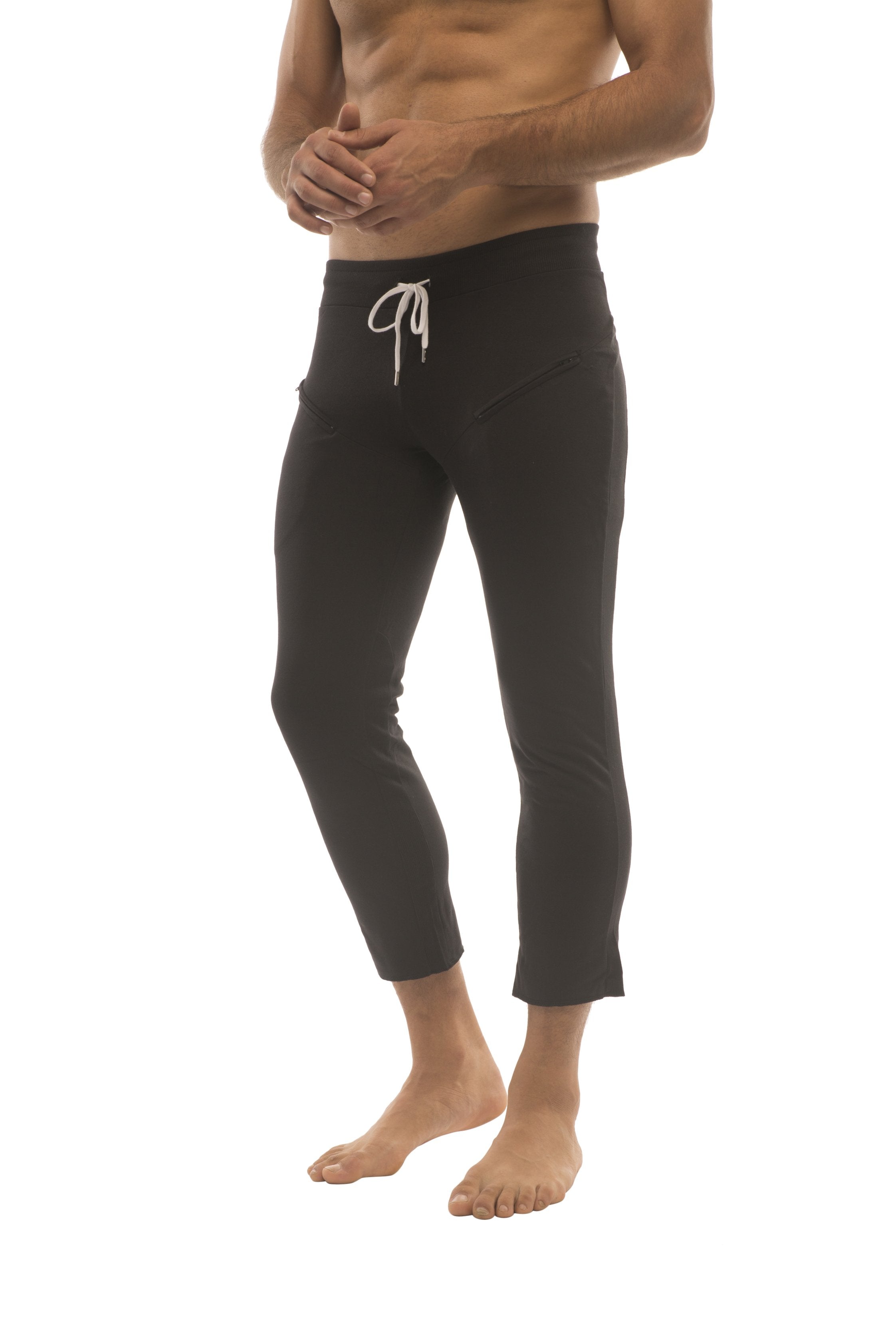 Mens 4/5 zipper pocket capri yoga pants in solid black with white drawstring waistband and cropped fit