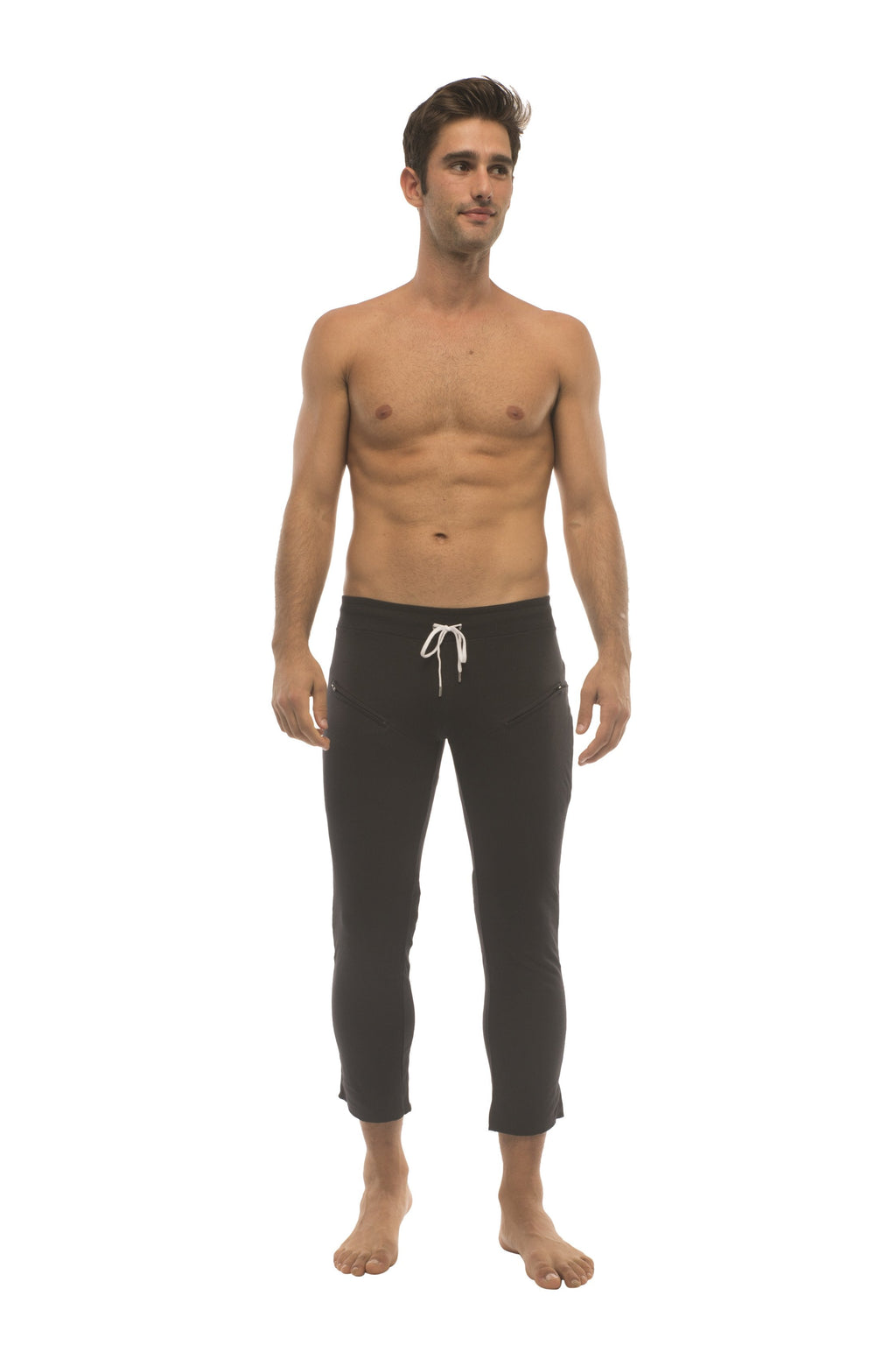 Mens solid black capri yoga pants with white drawstring waistband and side zipper pockets for active wear