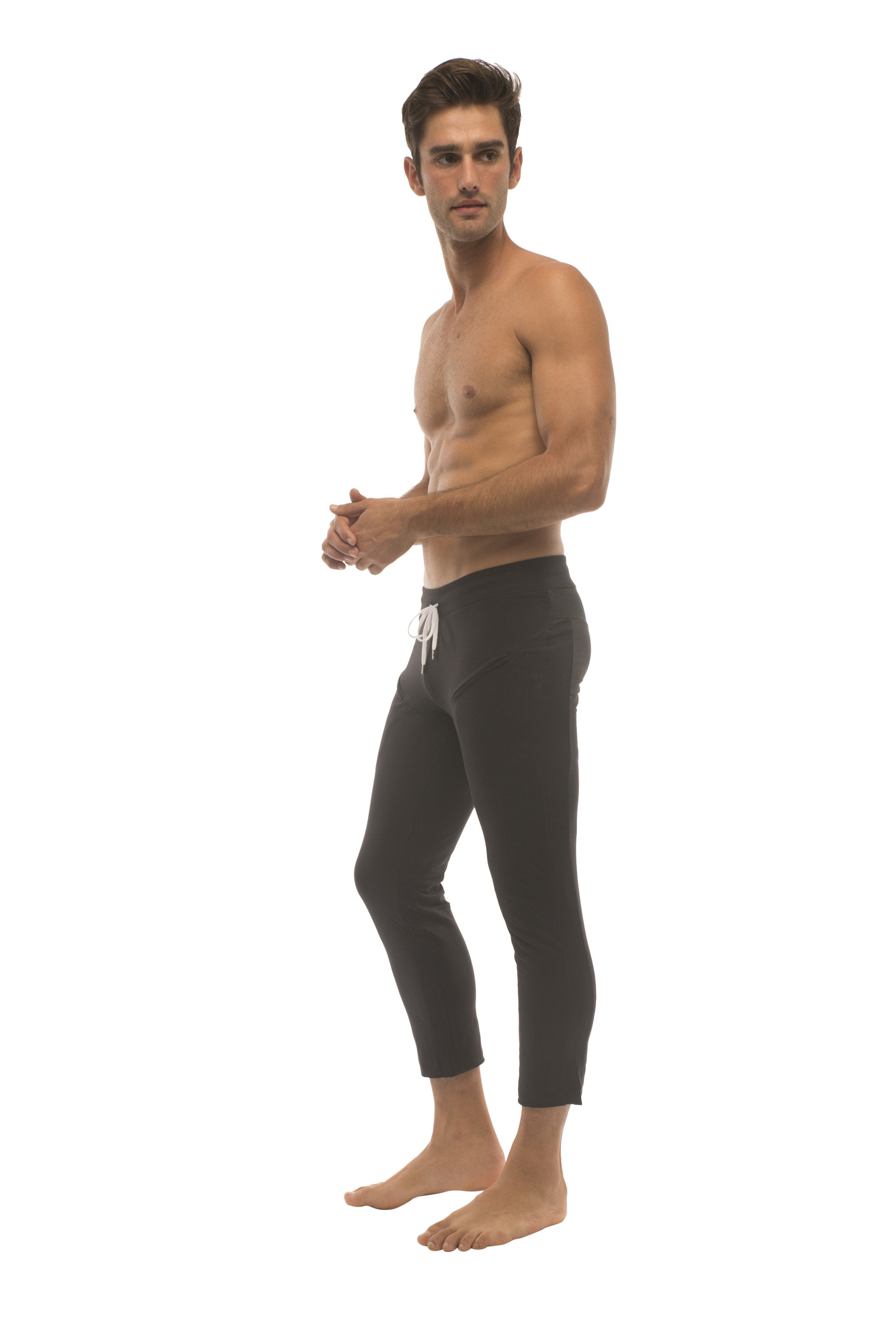 Mens 4 5 zipper pocket capri yoga pants in solid black with white drawstring waistband and cropped fit