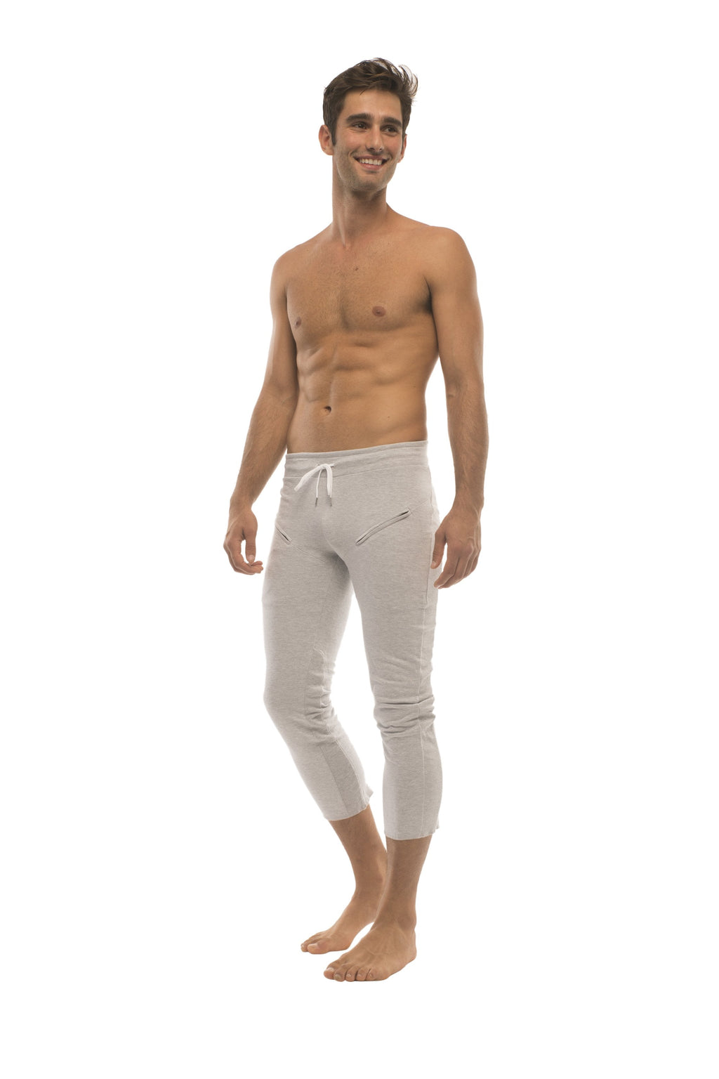 White cropped jogger pants with drawstring waist and zipper pockets ideal for mens 4/5 zipper pocket capri yoga pants