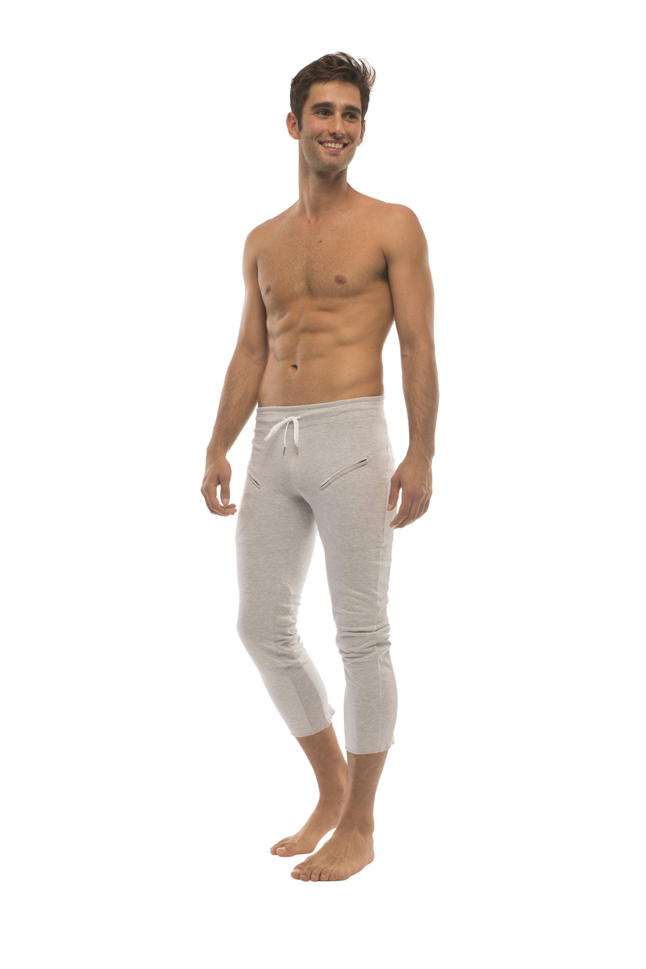 White cropped jogger pants with drawstring waist and zipper pockets ideal for mens 4/5 zipper pocket capri yoga pants