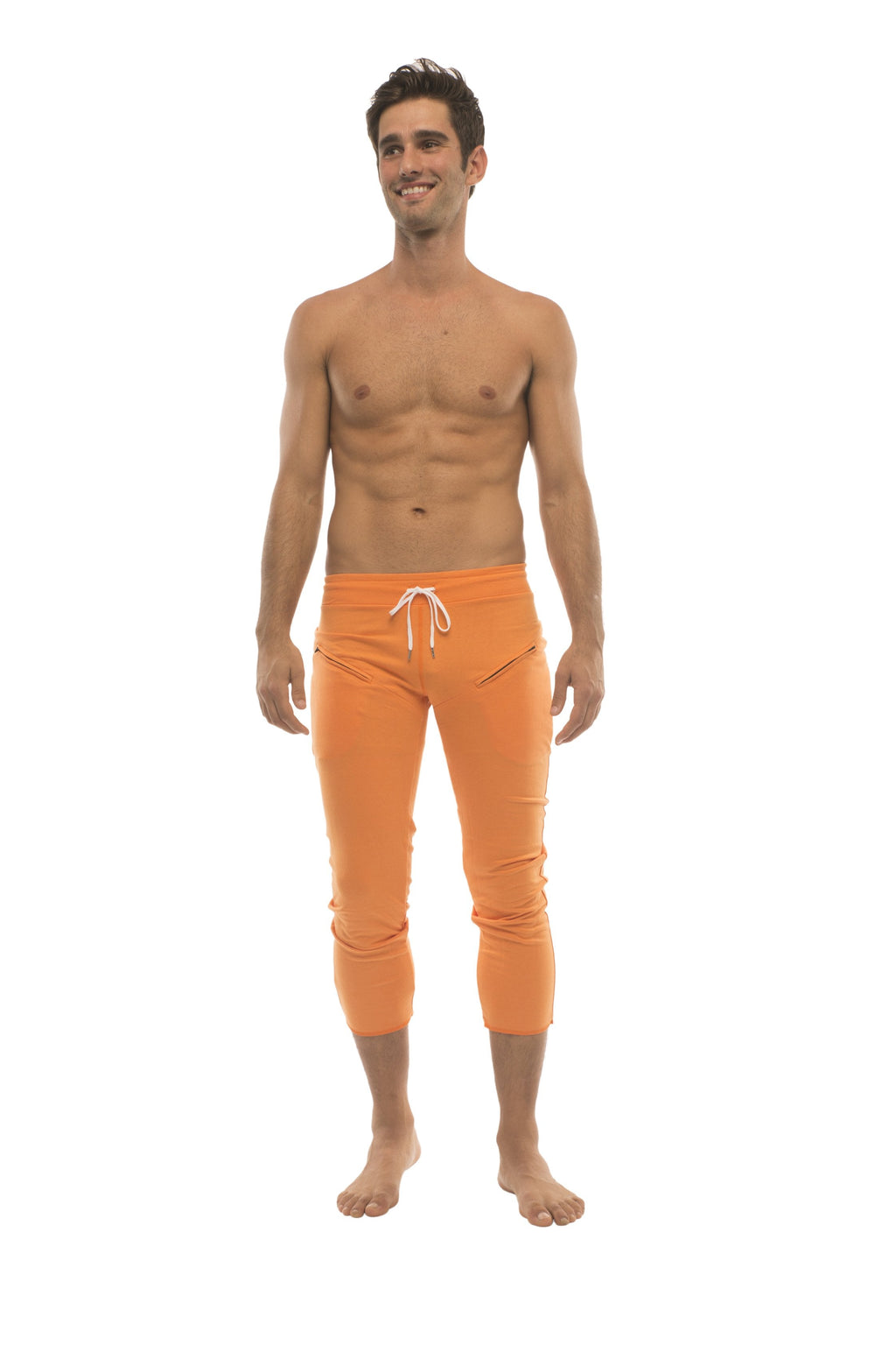 Orange capri-length mens yoga pants with white drawstring waistband and zipper pockets for athletic use