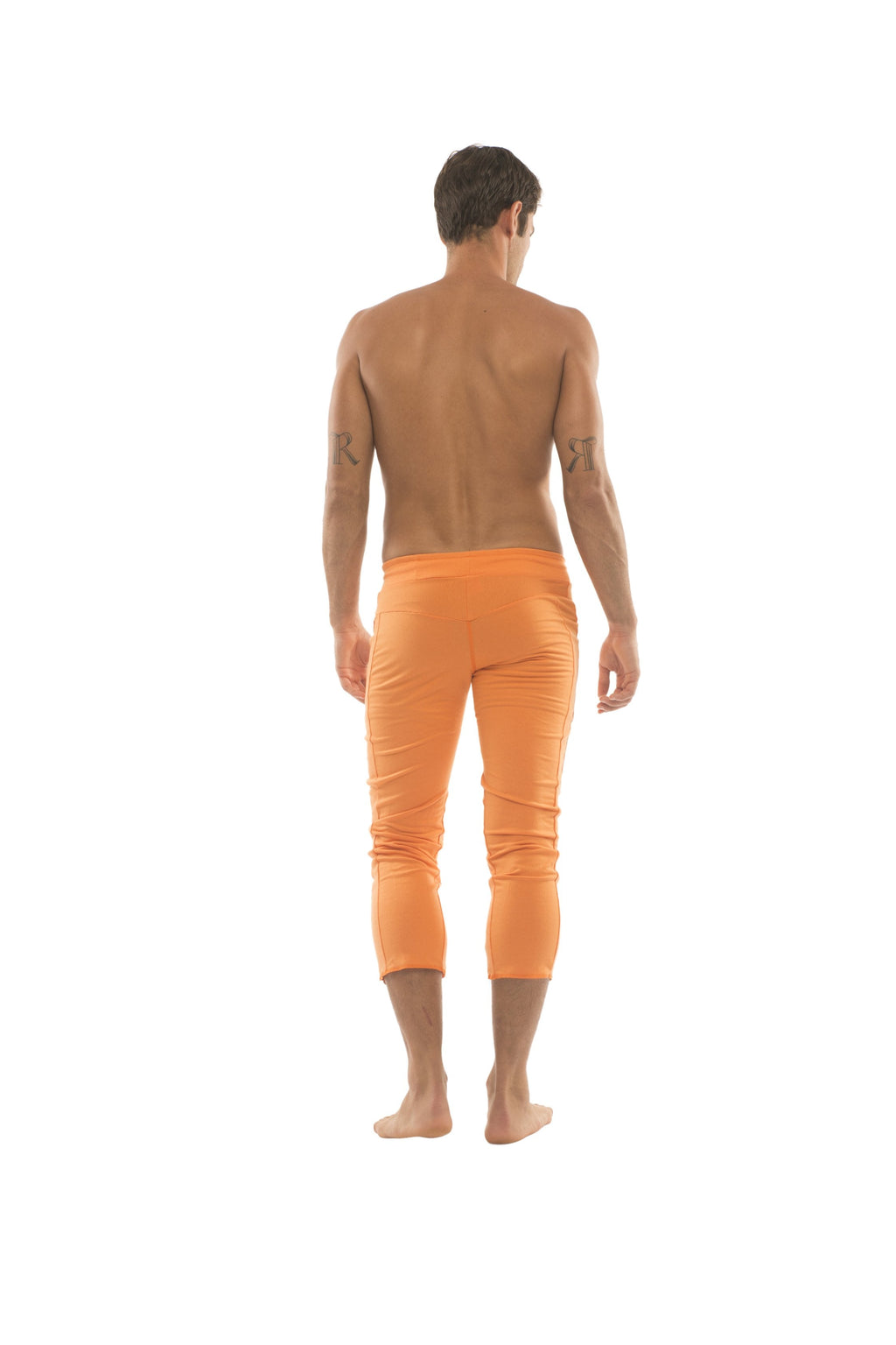 Men’s solid orange capri yoga pants with four zippered pockets designed for comfort and mobility