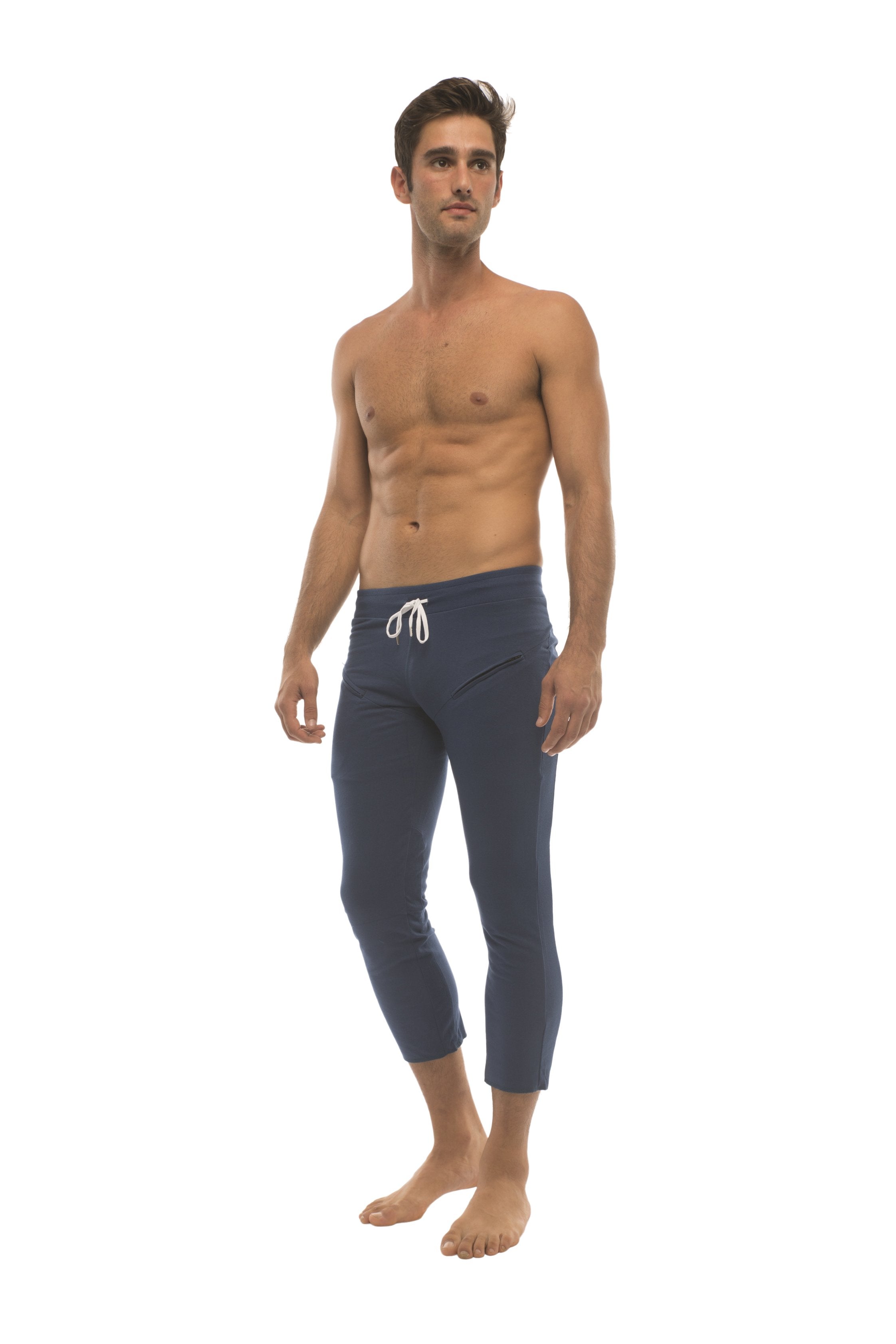 Mens solid royal blue 4/5 zipper pocket capri yoga pants with white drawstring waistband in navy blue