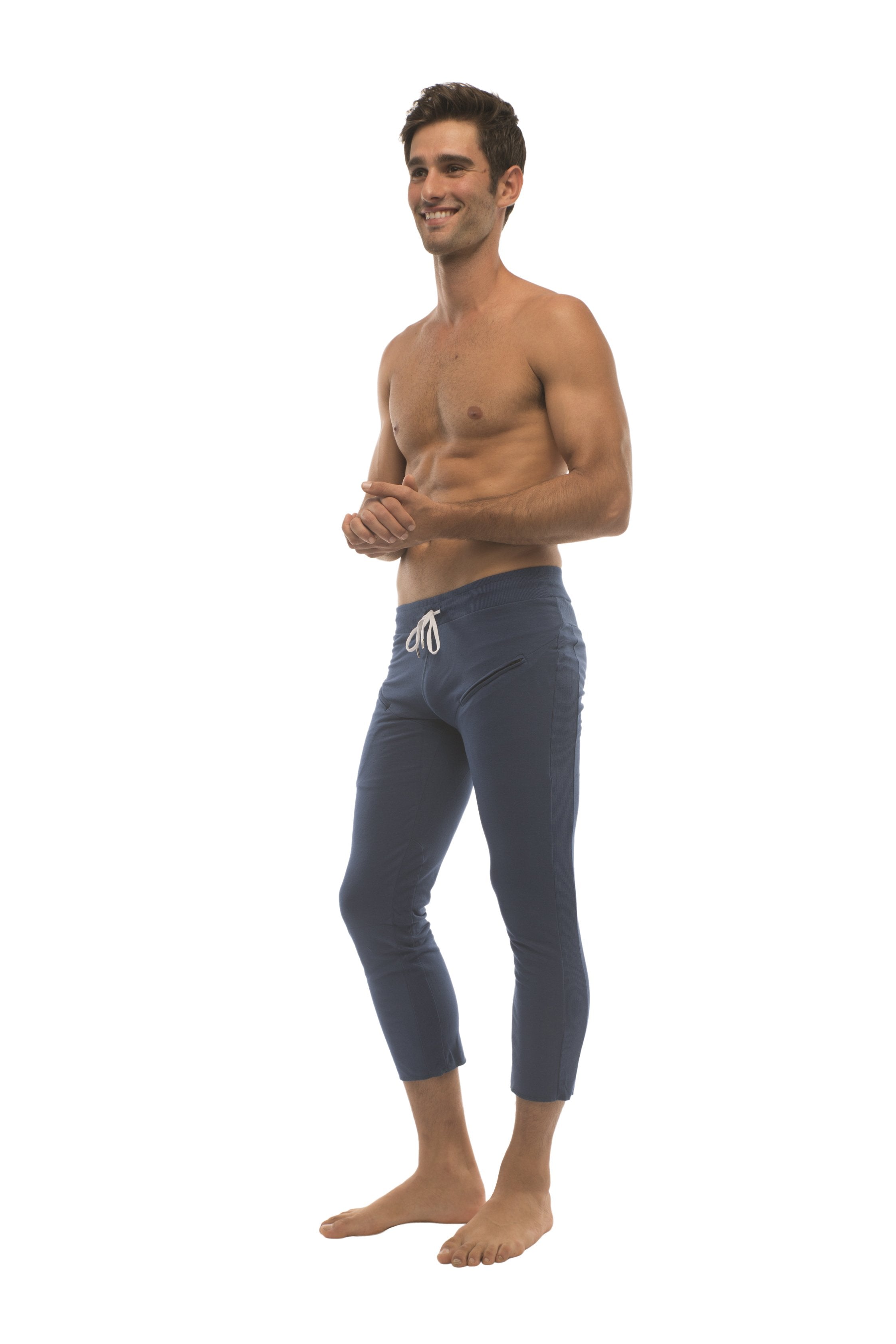 Mens solid royal blue capri yoga pants with white drawstring waistband and zipper pocket for activewear use