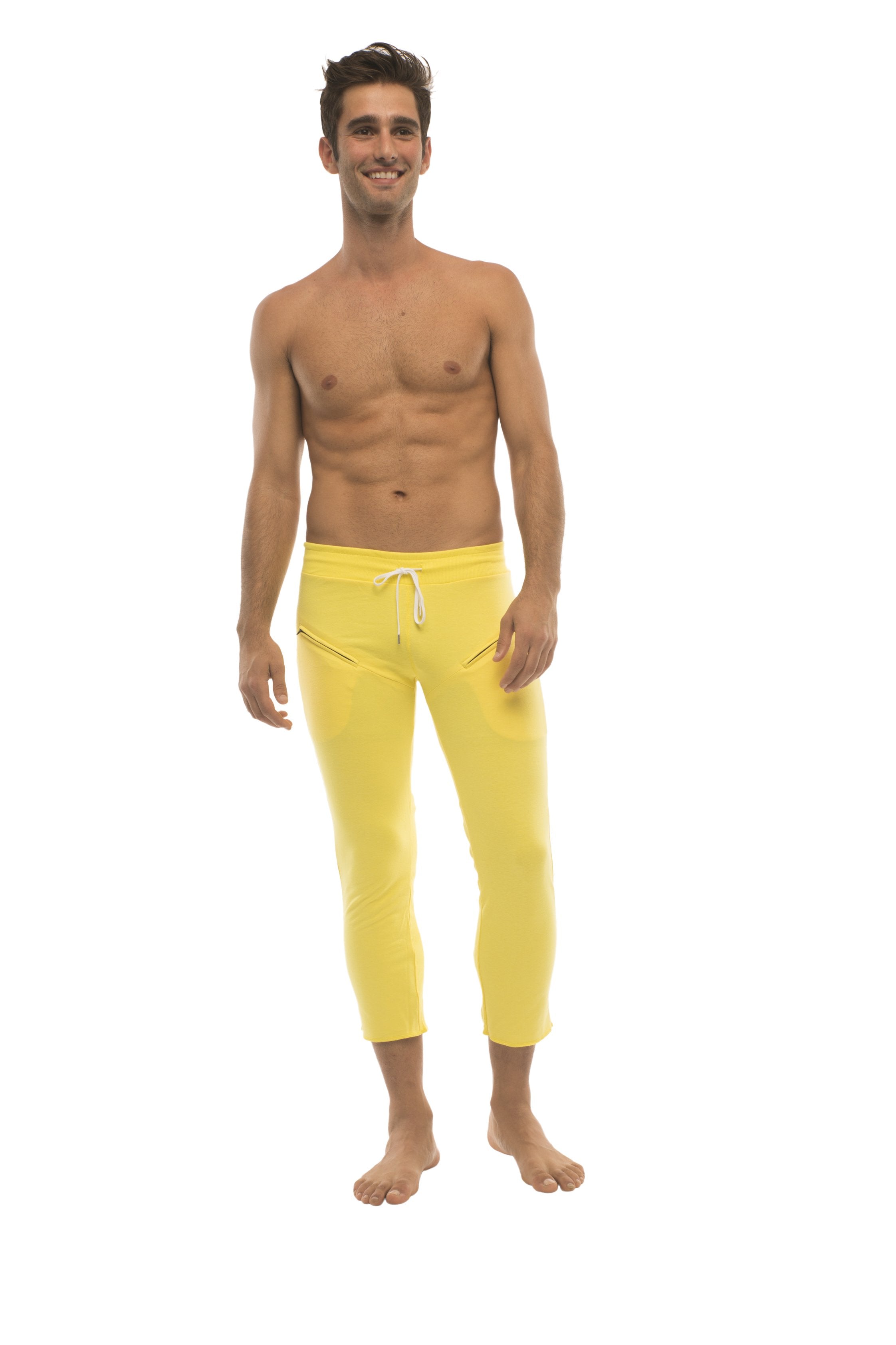 Mens solid yellow capri yoga pants with white drawstring waistband and side pockets for athletic wear