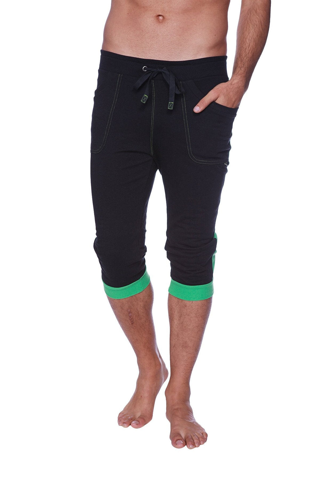 Mens cuffed yoga pants in black with green trim feature a drawstring waistband and side pockets for comfort and style