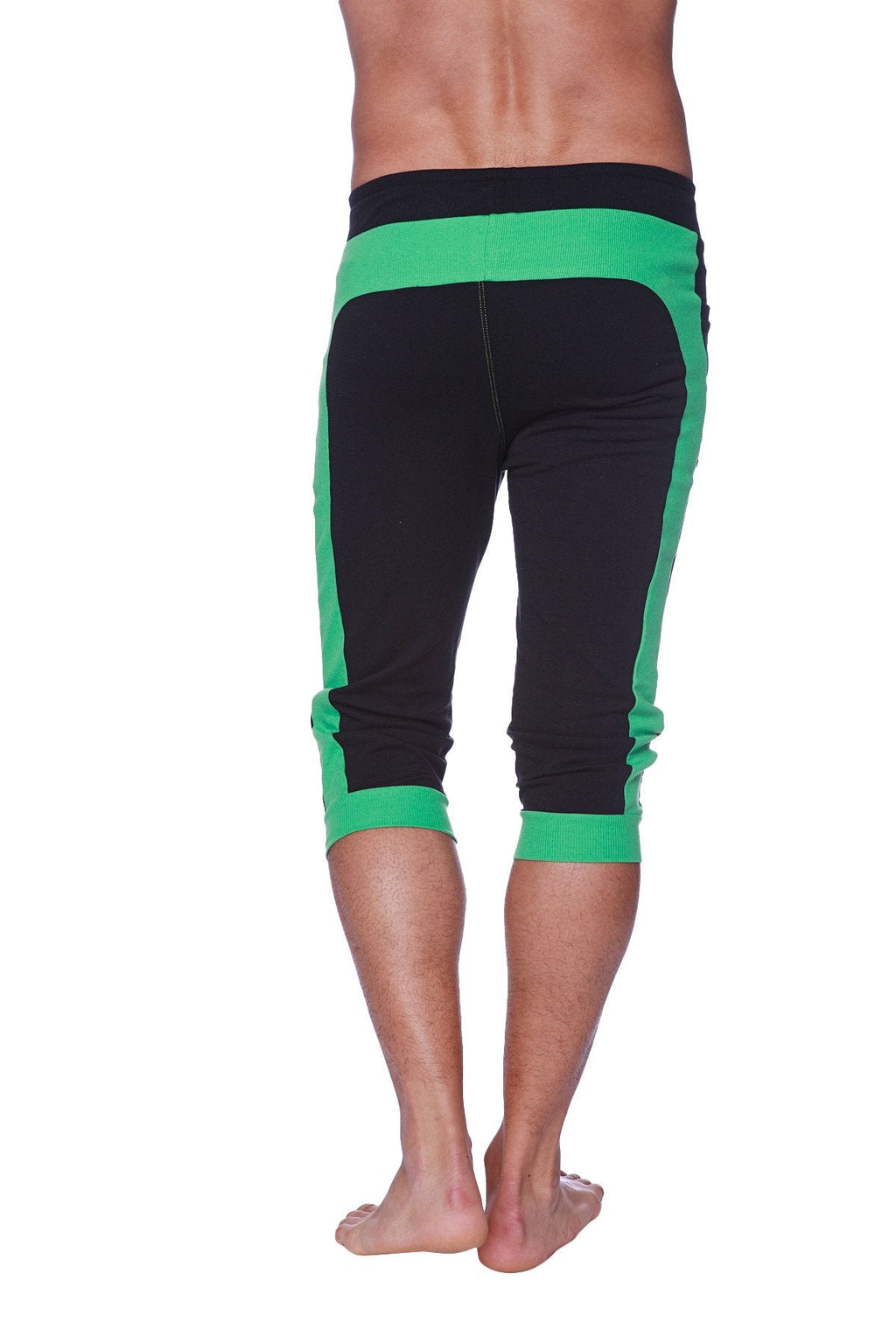 Mens cuffed yoga pants in black with neon green accents featuring elastic waistband and ribbed cuffs for comfort