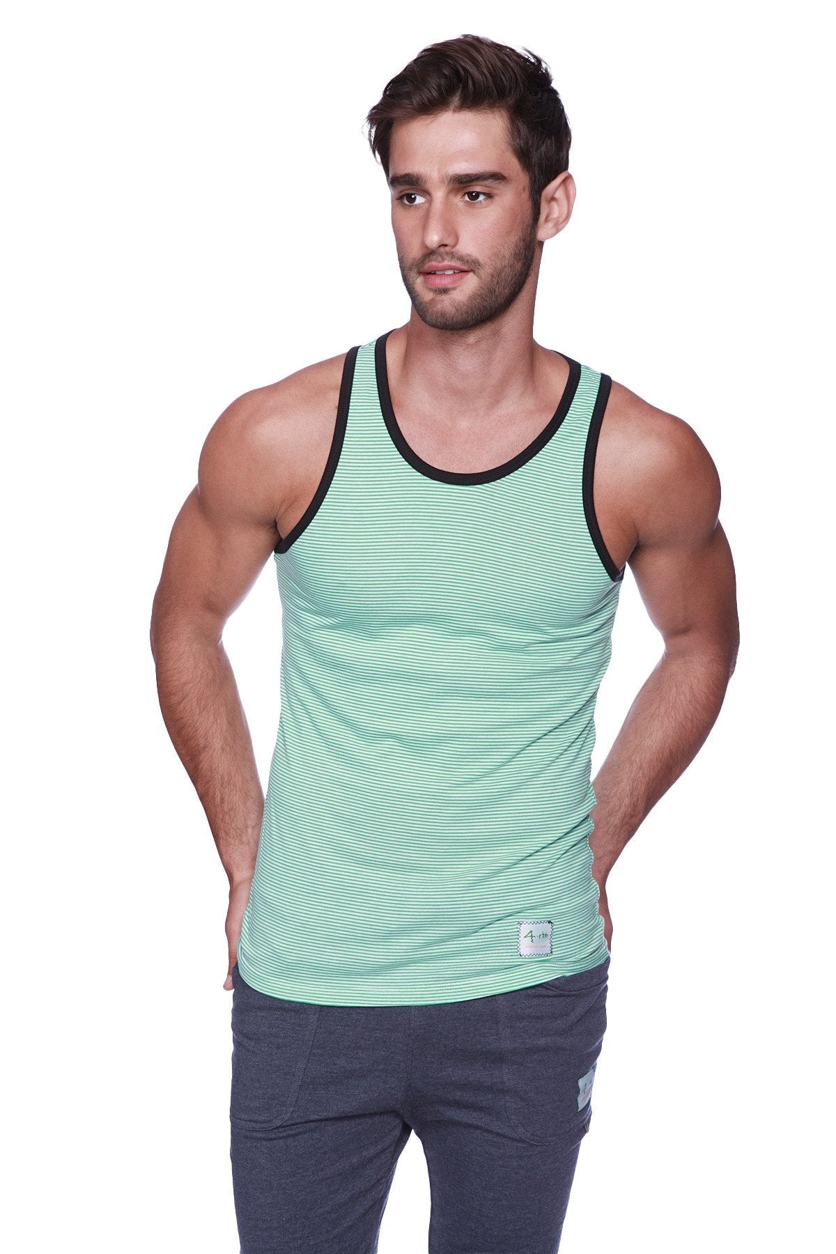 A men’s mint green and black striped tank top with ribbed neckline paired with black and green cuffed yoga pants