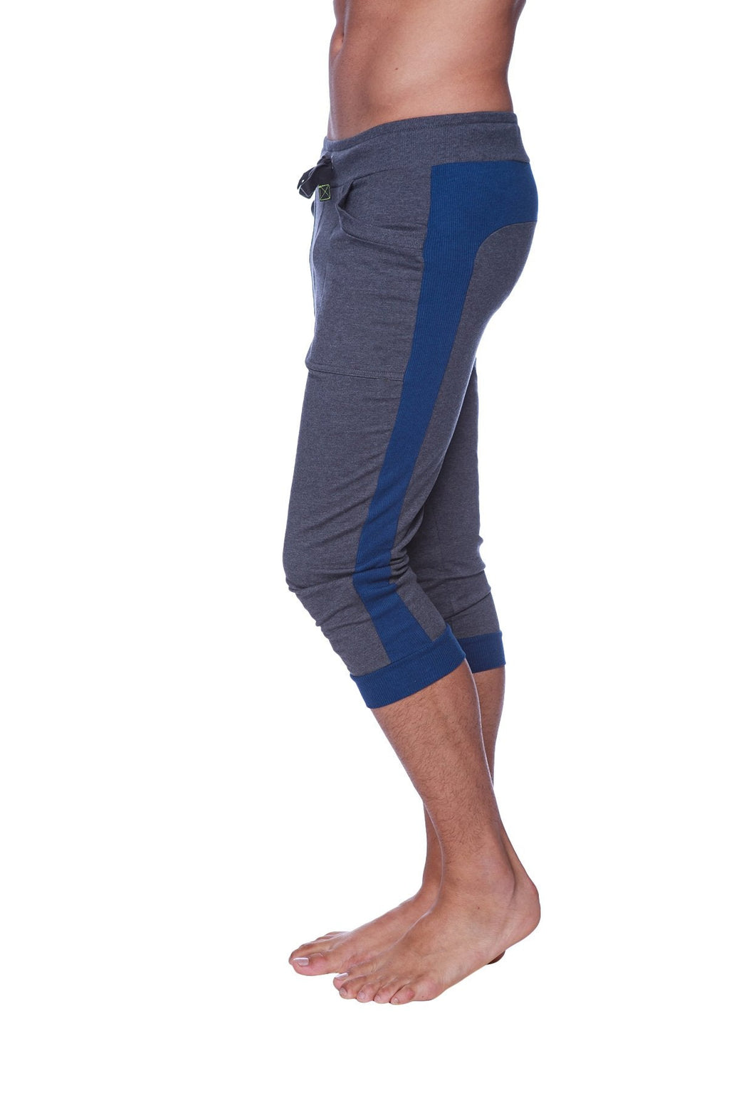 Mens cuffed yoga pants in charcoal with royal blue featuring gray and blue athletic capri design and drawstring waistband