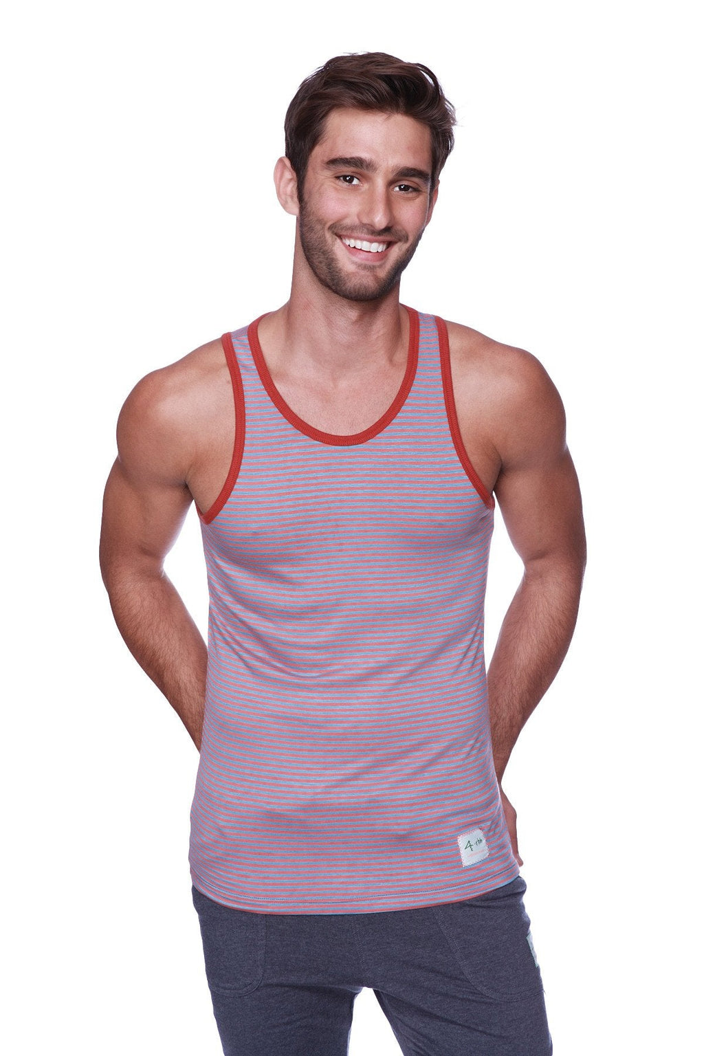 A mauve and red striped tank top with ribbed neckline paired with solid charcoal mens cuffed yoga pants