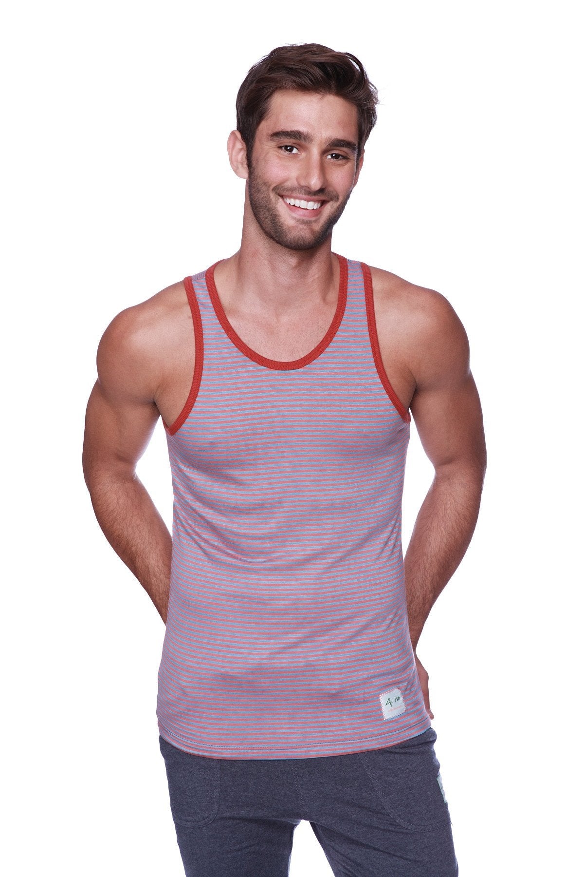 A mauve and red striped tank top with ribbed neckline paired with solid charcoal mens cuffed yoga pants