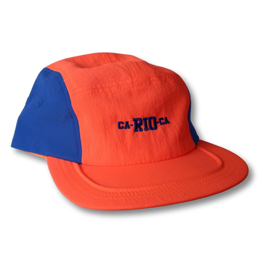 Vibrant orange and blue neon dream bike cap hat with navy ca-rio-ca embroidery in five-panel design
