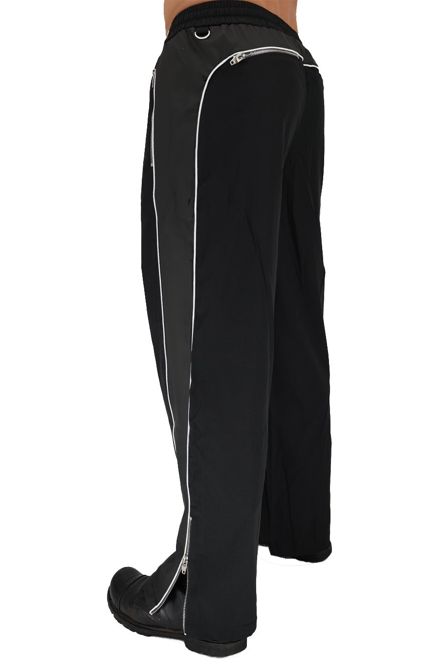 Black NSA track pants with white zipper and piping details designed for athletic wear and comfort