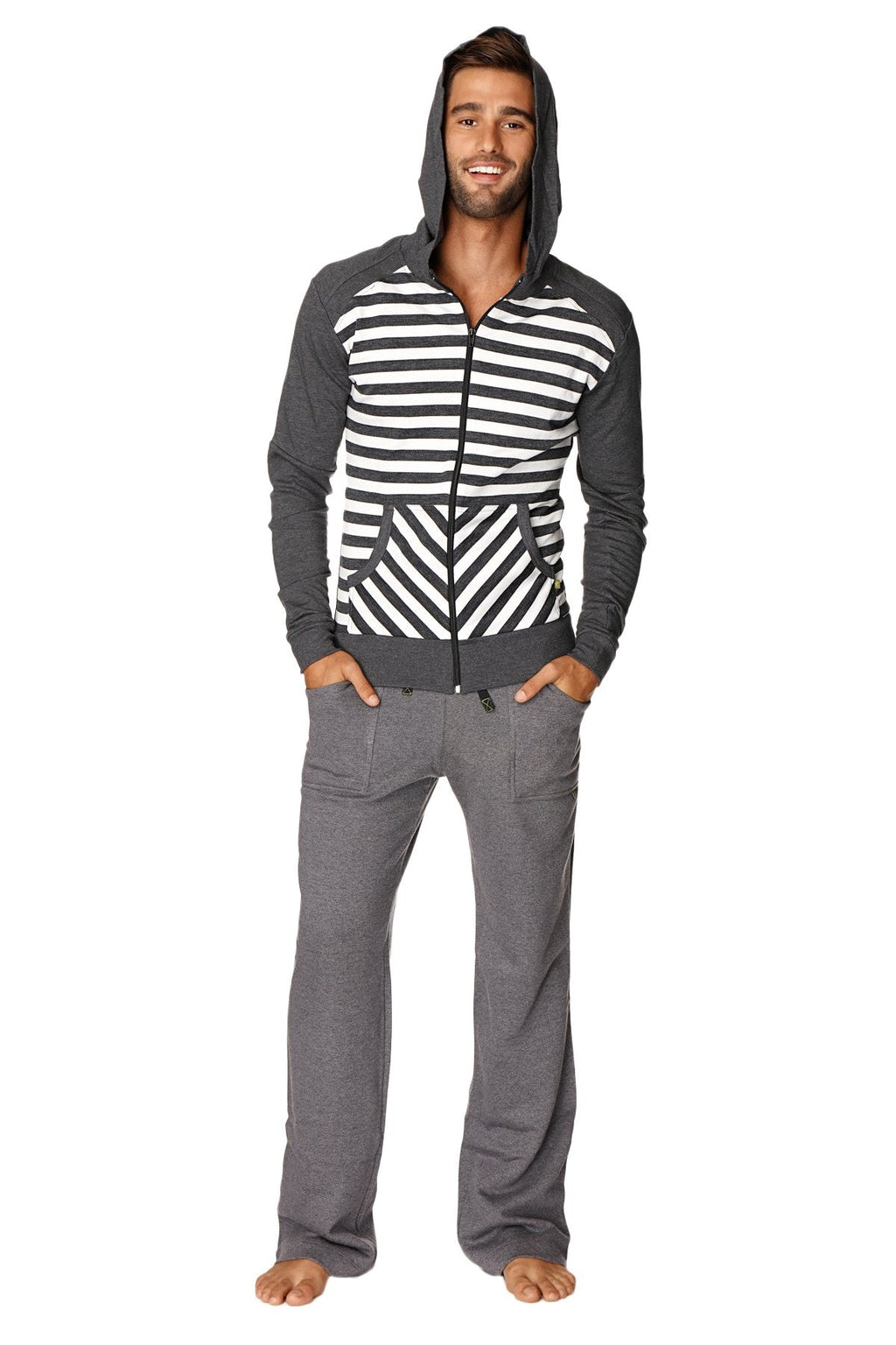 A man wearing an original limited edition form-fit crossover yoga track charcoal stripe fleece hoodie with geometric patterns