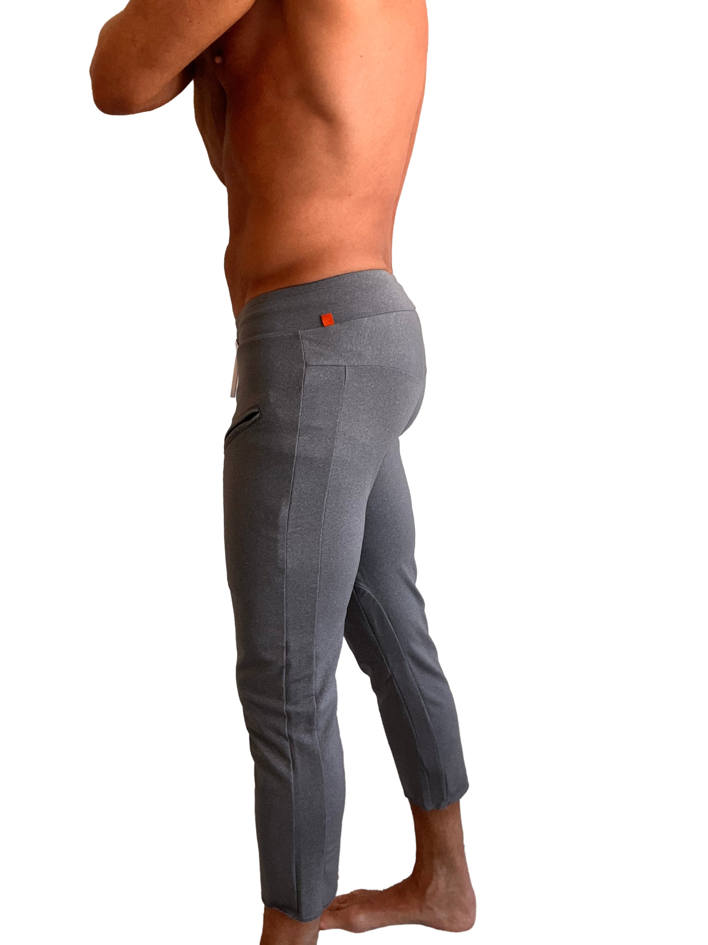 Performance premium mens dark grey heather capri yoga pants featuring a sleek form-fitting design and subtle texture