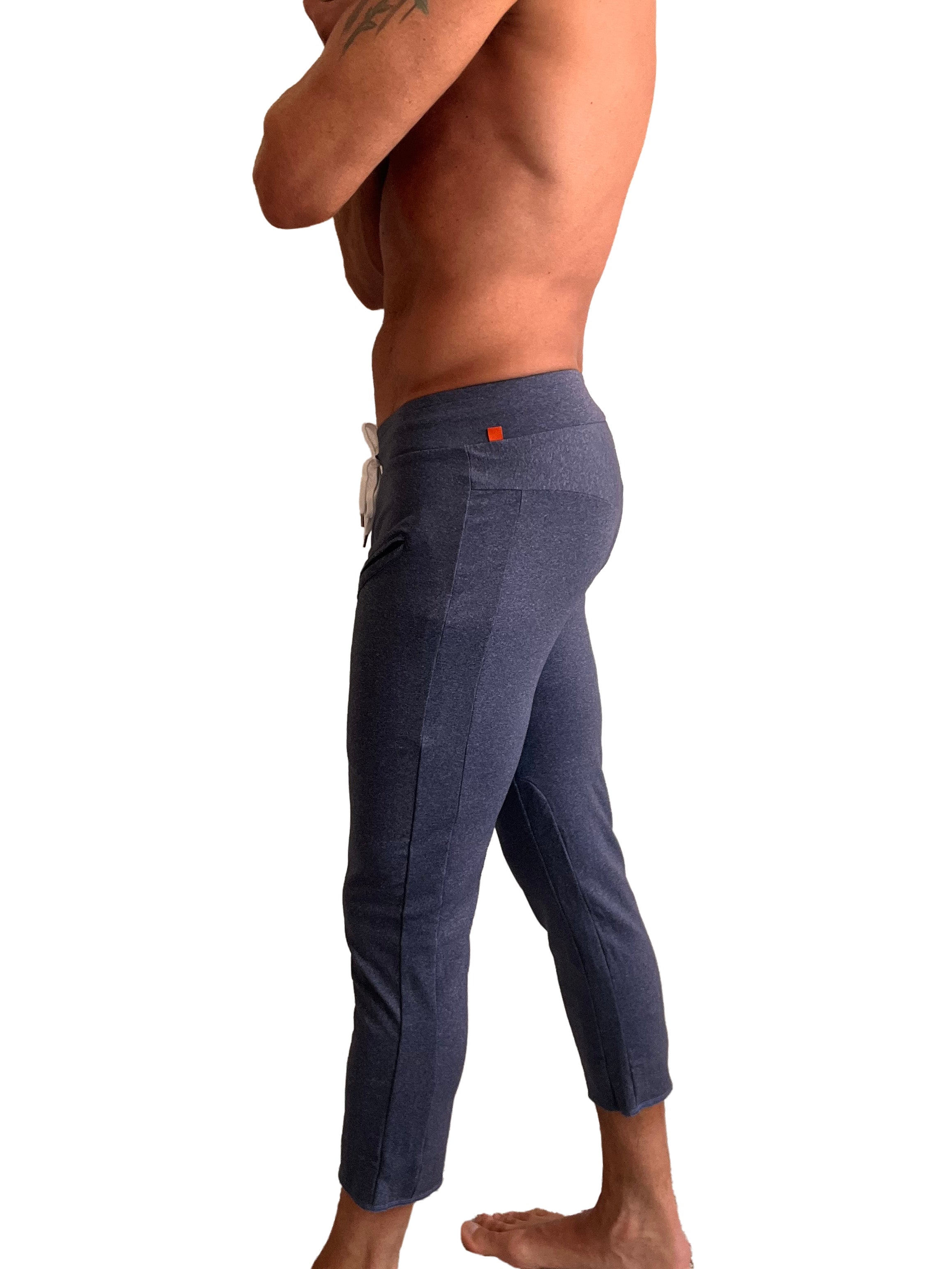 Performance premium mens navy blue heather joggers with white drawstring orange brand tag and textured fabric