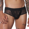 Black men's trunk underwear featuring a sheer, delicate floral lace pattern, a solid waistband, and solid front panel.