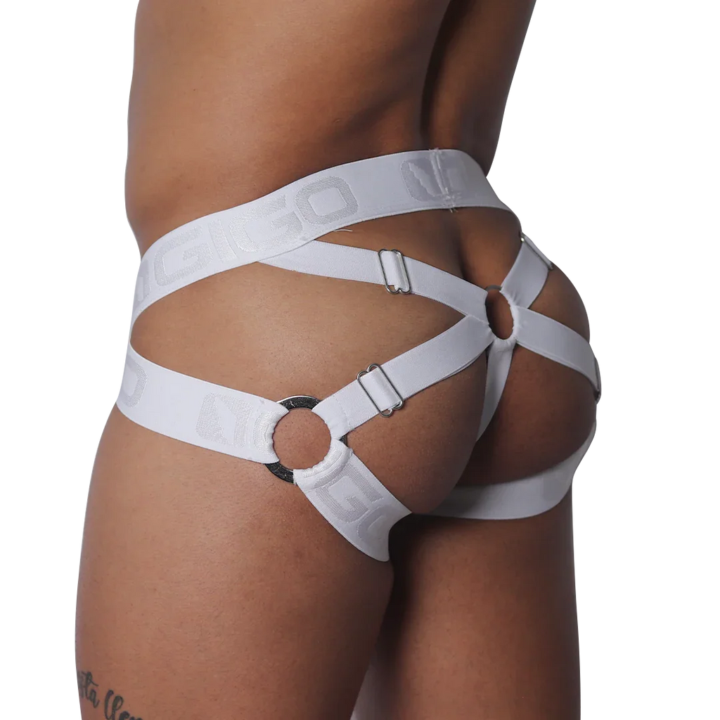 White elastic jockstrap featuring a strappy cage design with metal rings, adjustable buckles, and logo-embossed bands.