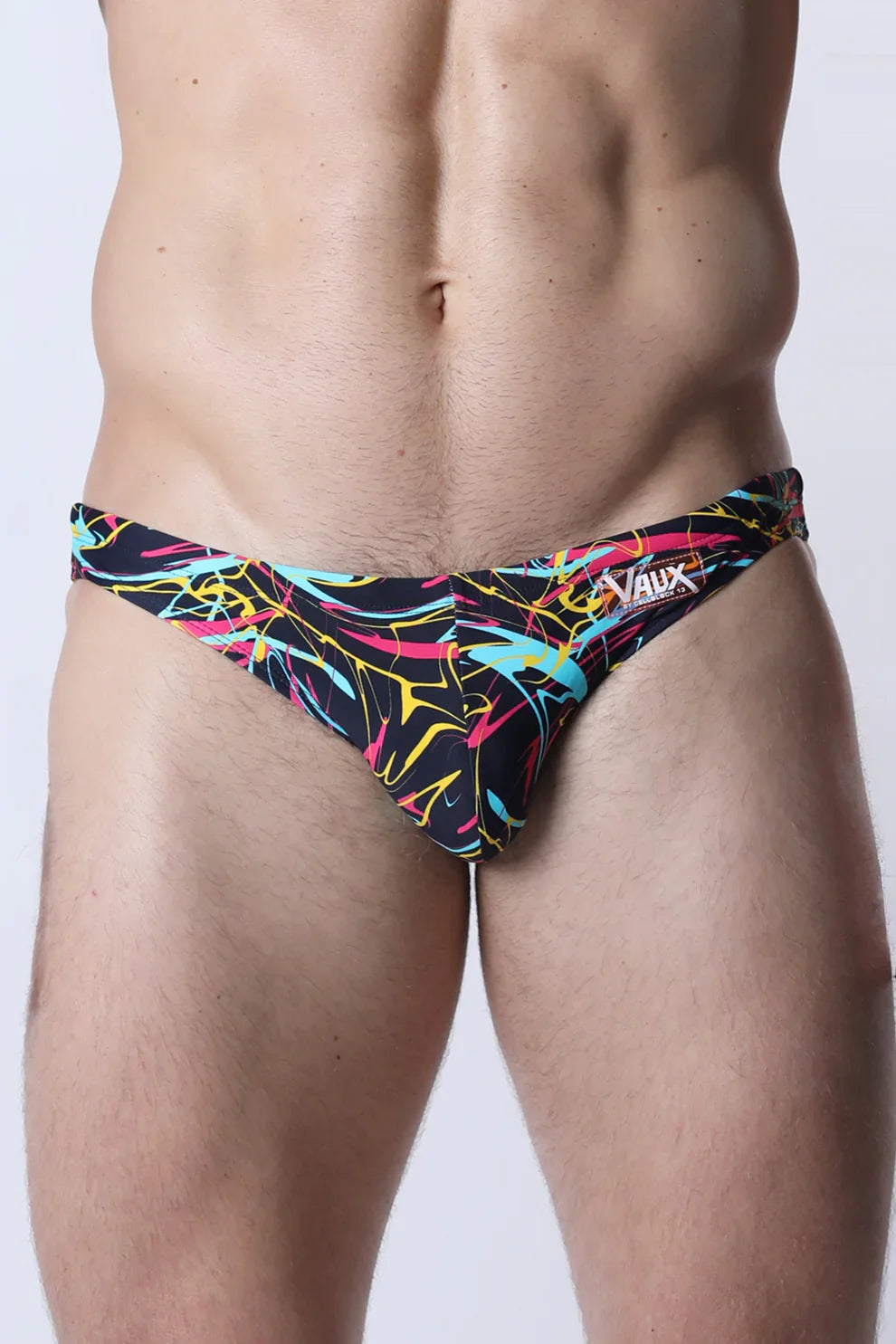 Pulse swim brief black swim trunks with vibrant neon pink yellow and cyan abstract line patterns for swimming