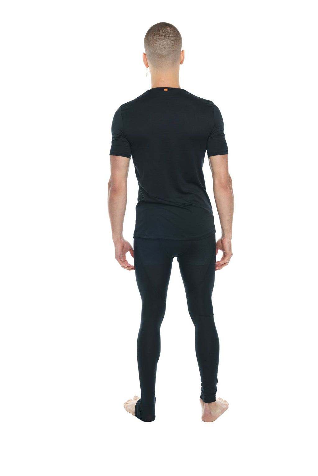 Black carbon perfect pocket crew neck tee paired with black seamless form fitting short sleeve and full length leggings set