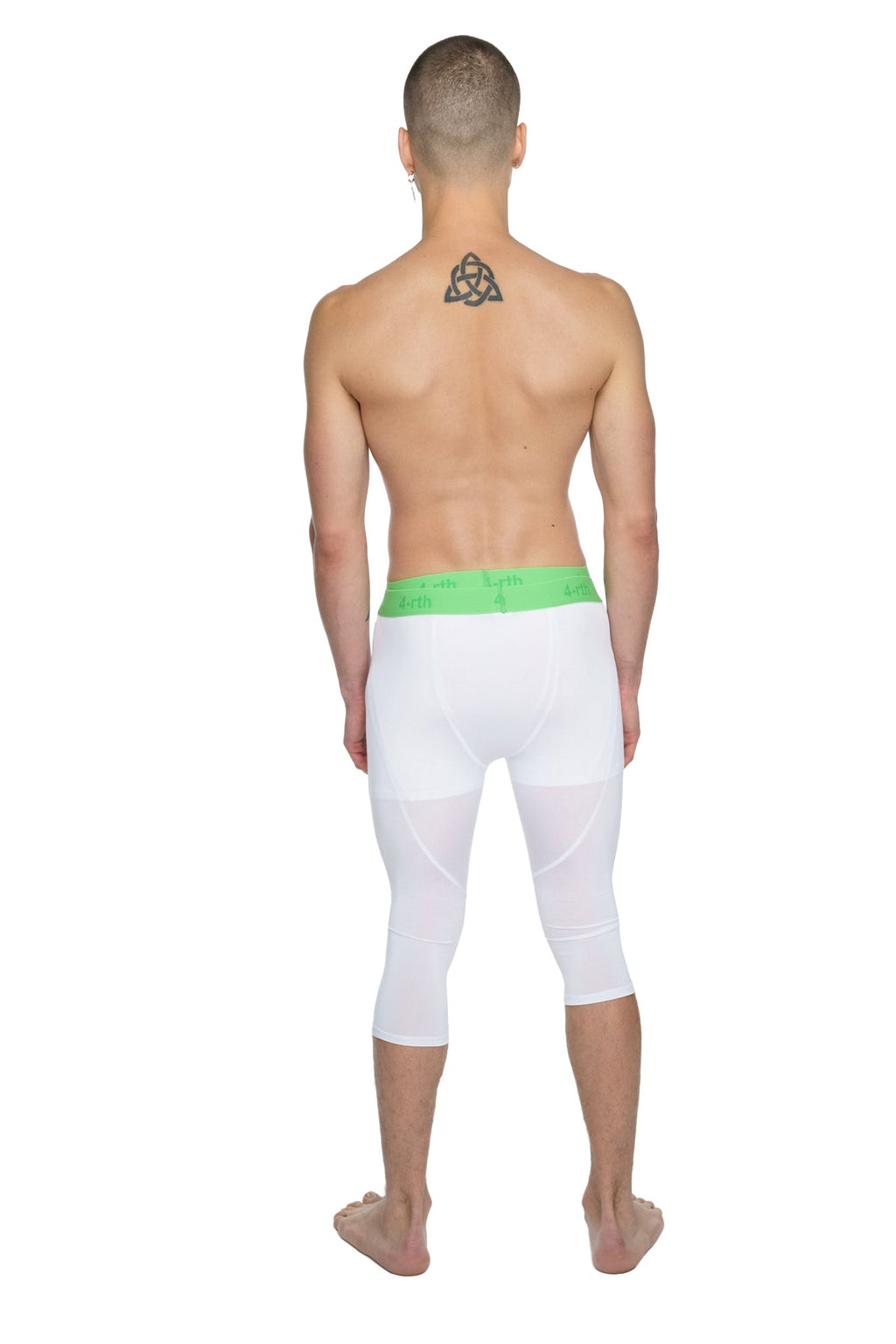 White capri-length performance yoga leggings with bright green elastic waistband designed for active wear