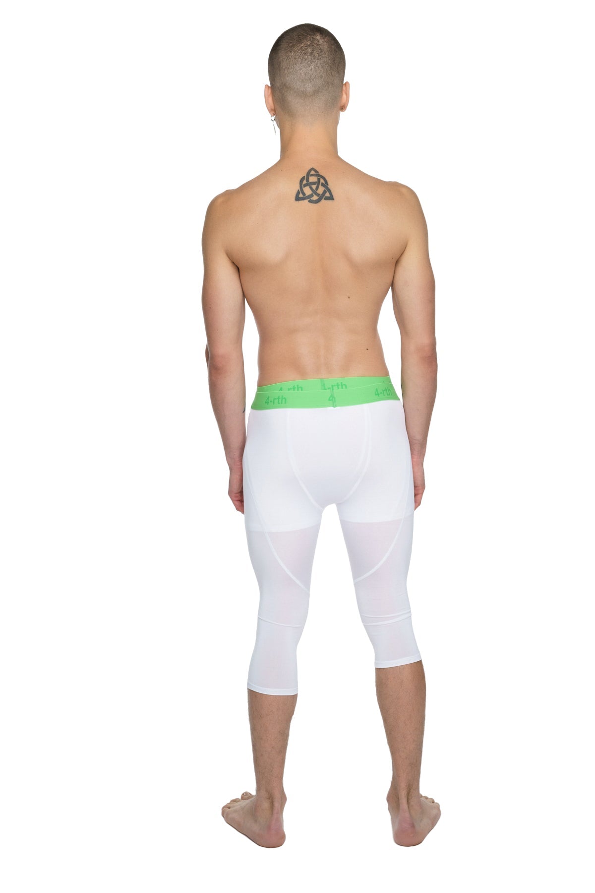 White capri-length performance yoga leggings with bright green elastic waistband designed for active wear
