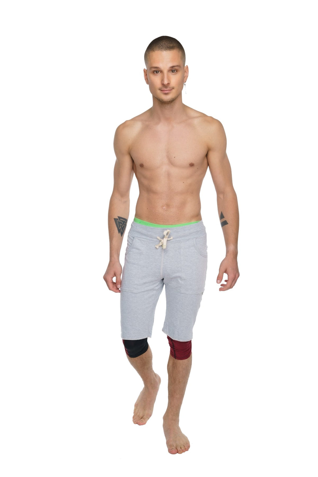 Performance yoga leggings 3/4 in brick red heather with light gray athletic shorts featuring neon green waistband and knee patches