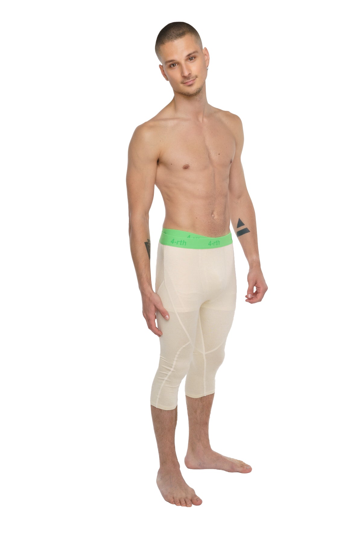 Performance yoga leggings 3/4 in sand beige with cream-colored fabric and bright green waistband featuring brand name