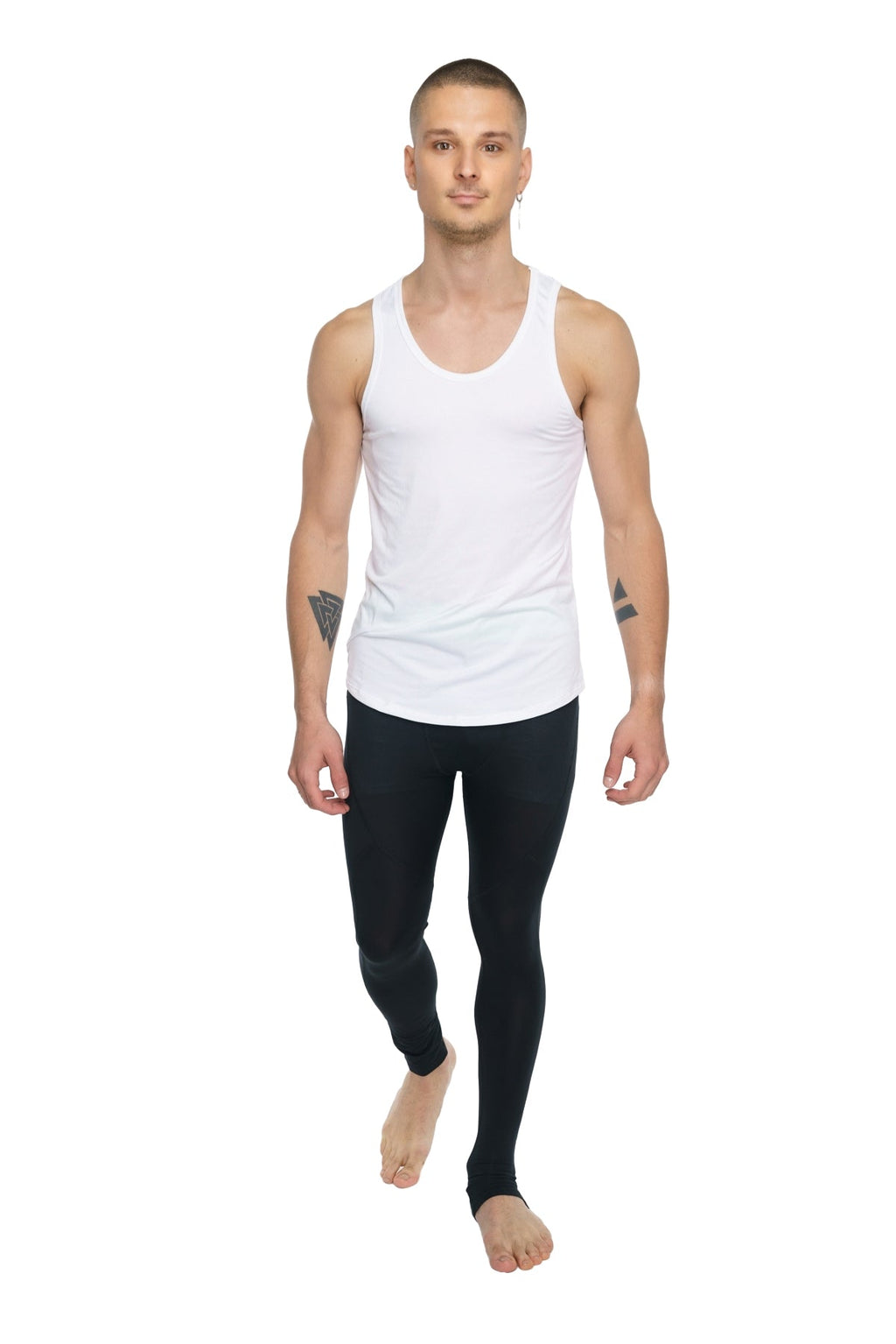 White sleeveless tank top with a simple fitted design paired with carbon black performance yoga leggings long length