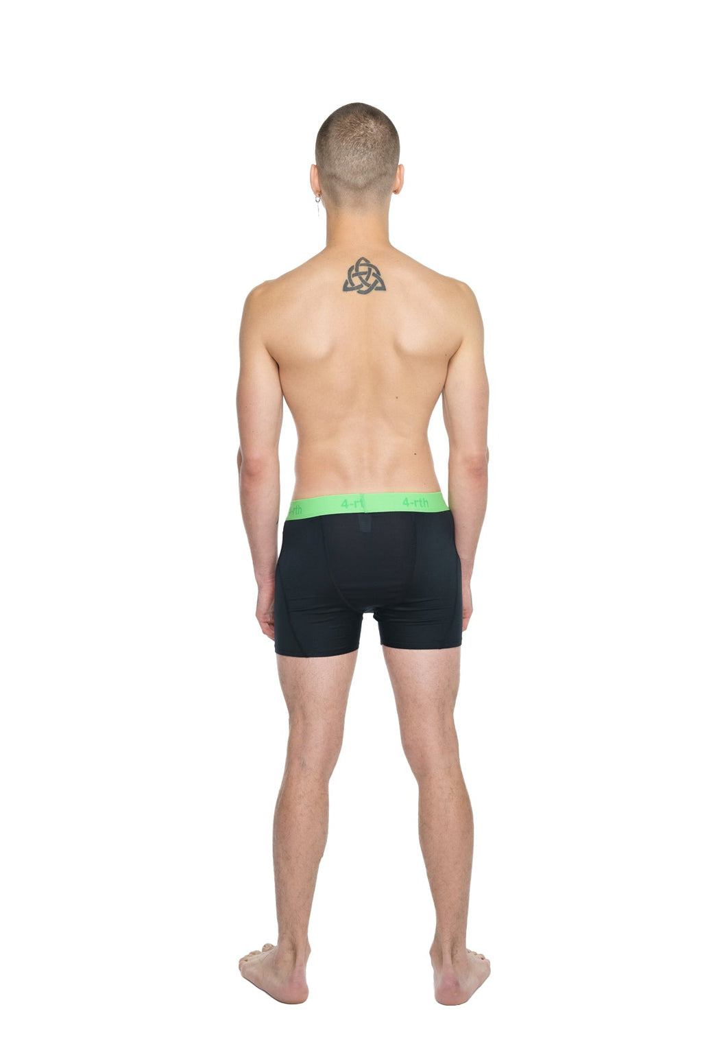 Black performance yoga leggings short in carbon black with bright green elastic waistband for active use