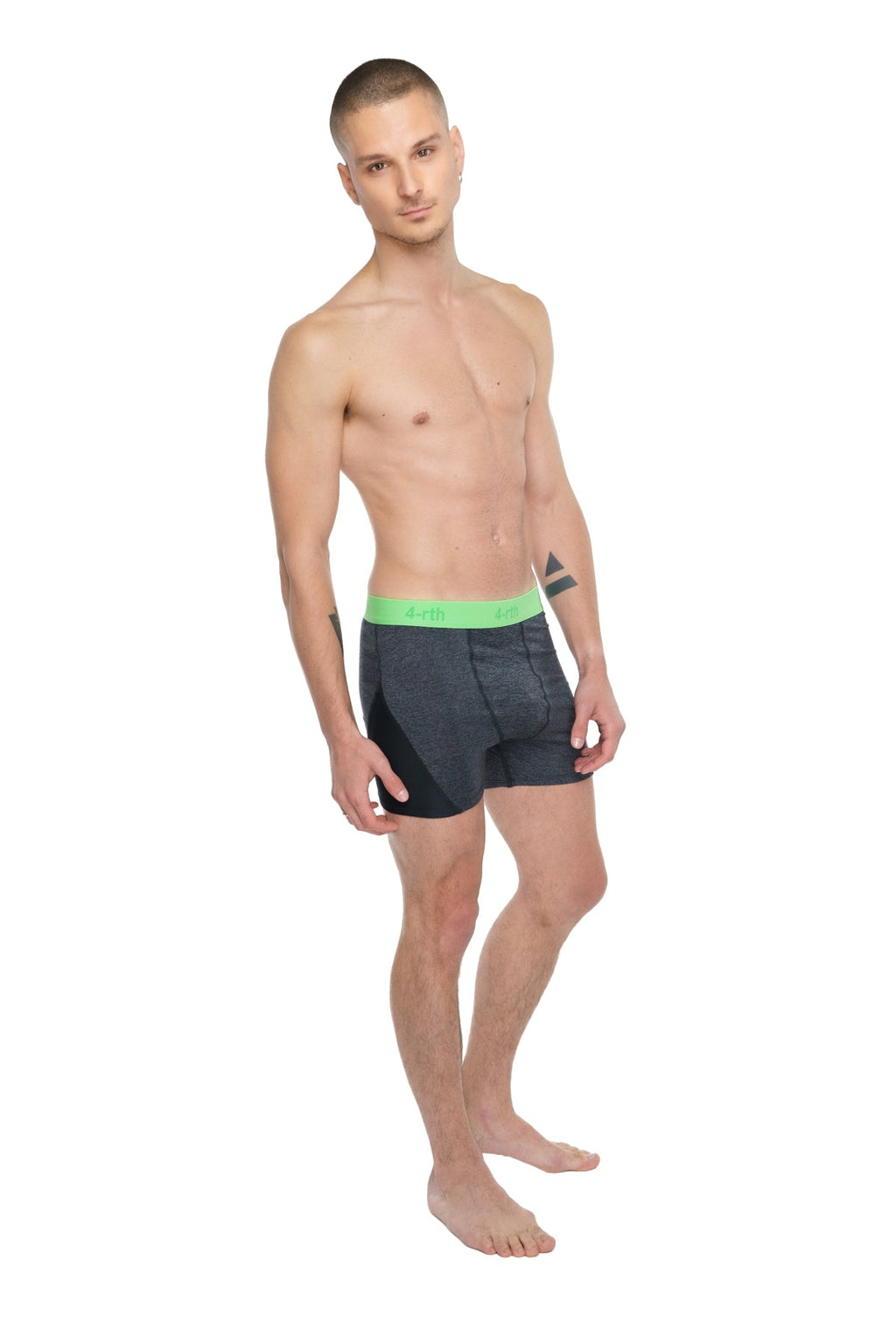 Black boxer briefs with bright green elastic waistband designed for performance yoga and active wear